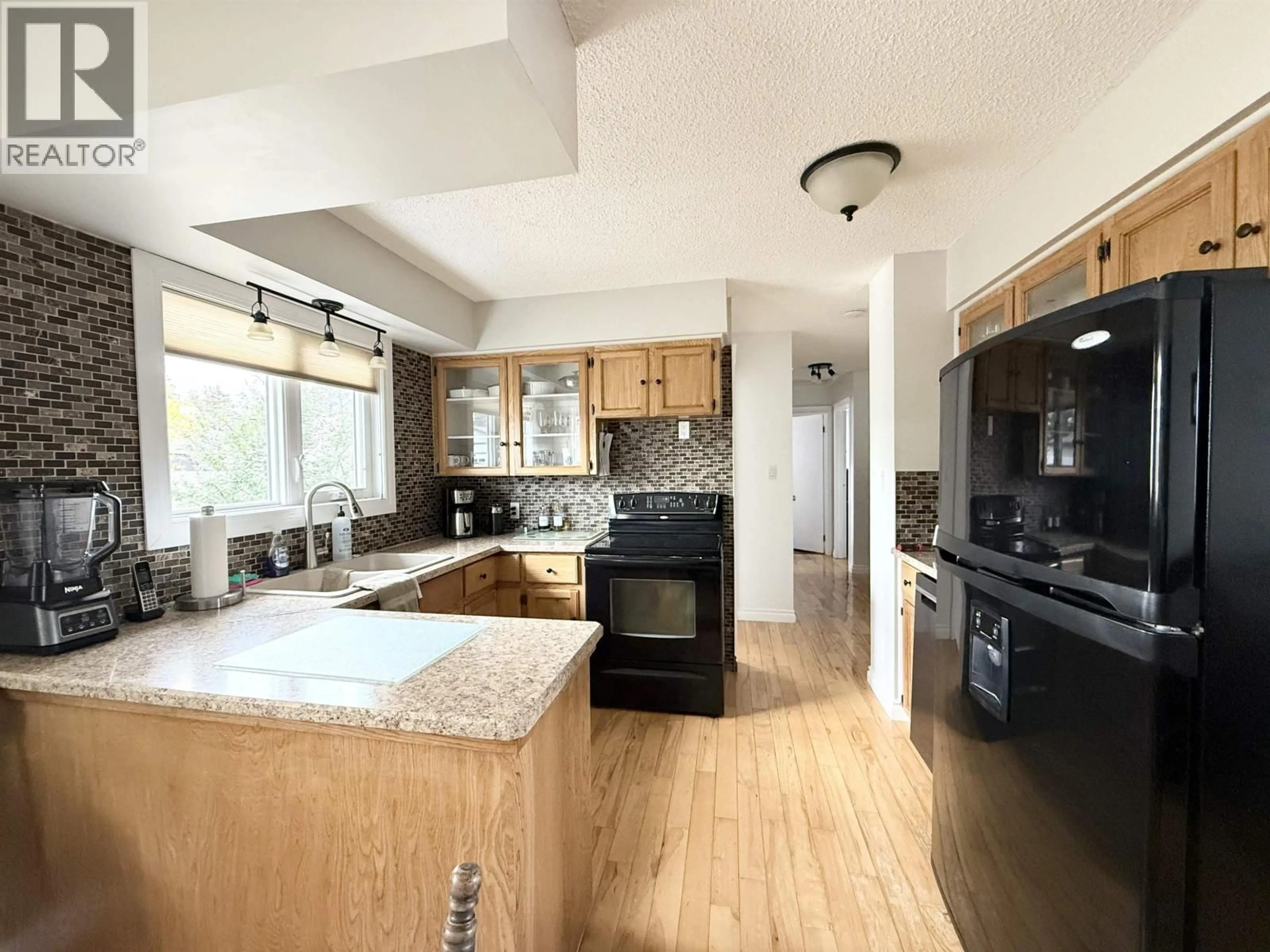 Open concept kitchen, unknown for 9803 113 AVENUE, Fort St. John British Columbia V1J4P7