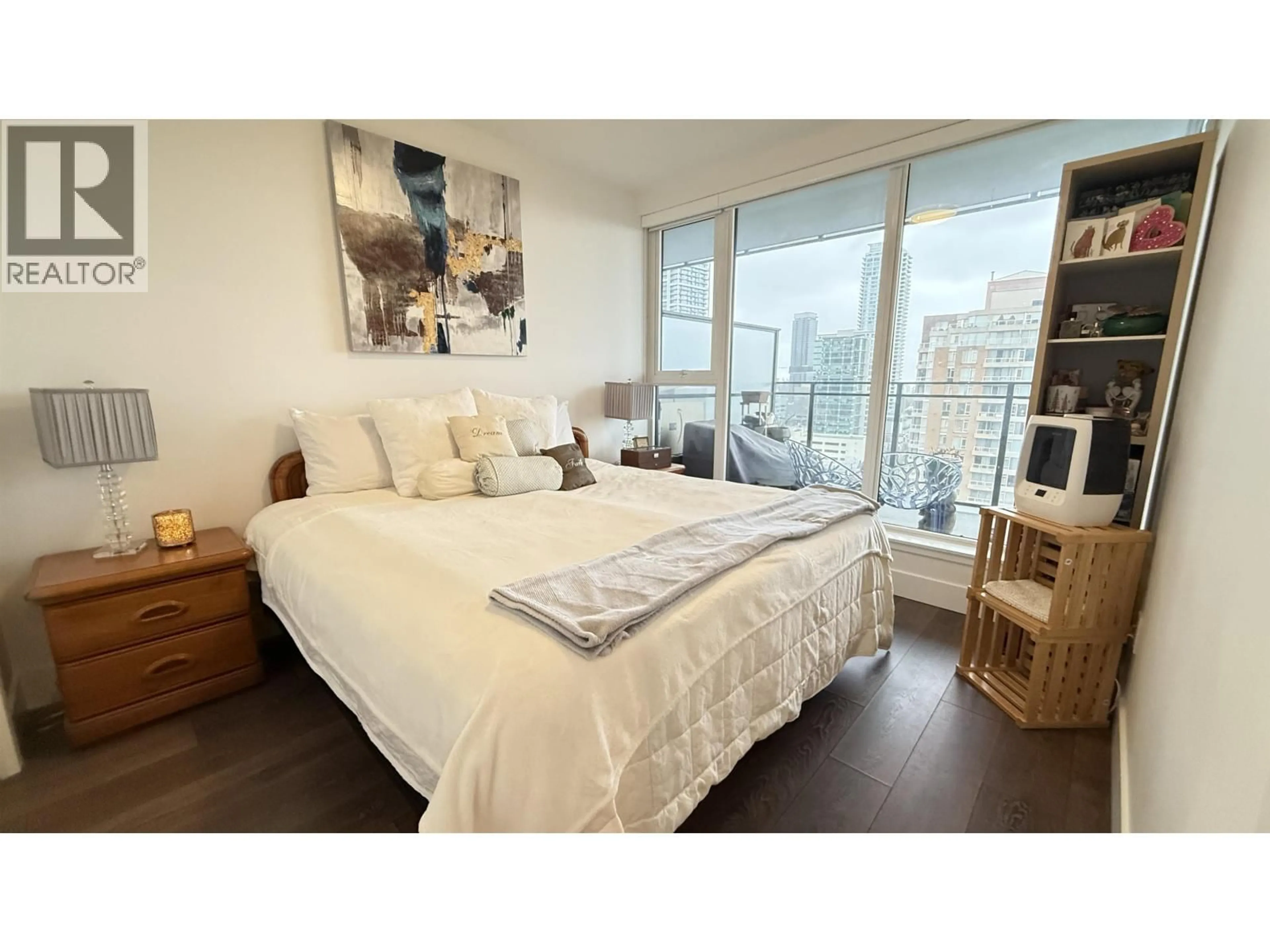 Bedroom with bed, wood/laminate floor for 1407 - 4711 HAZEL STREET, Burnaby British Columbia V5H0J9