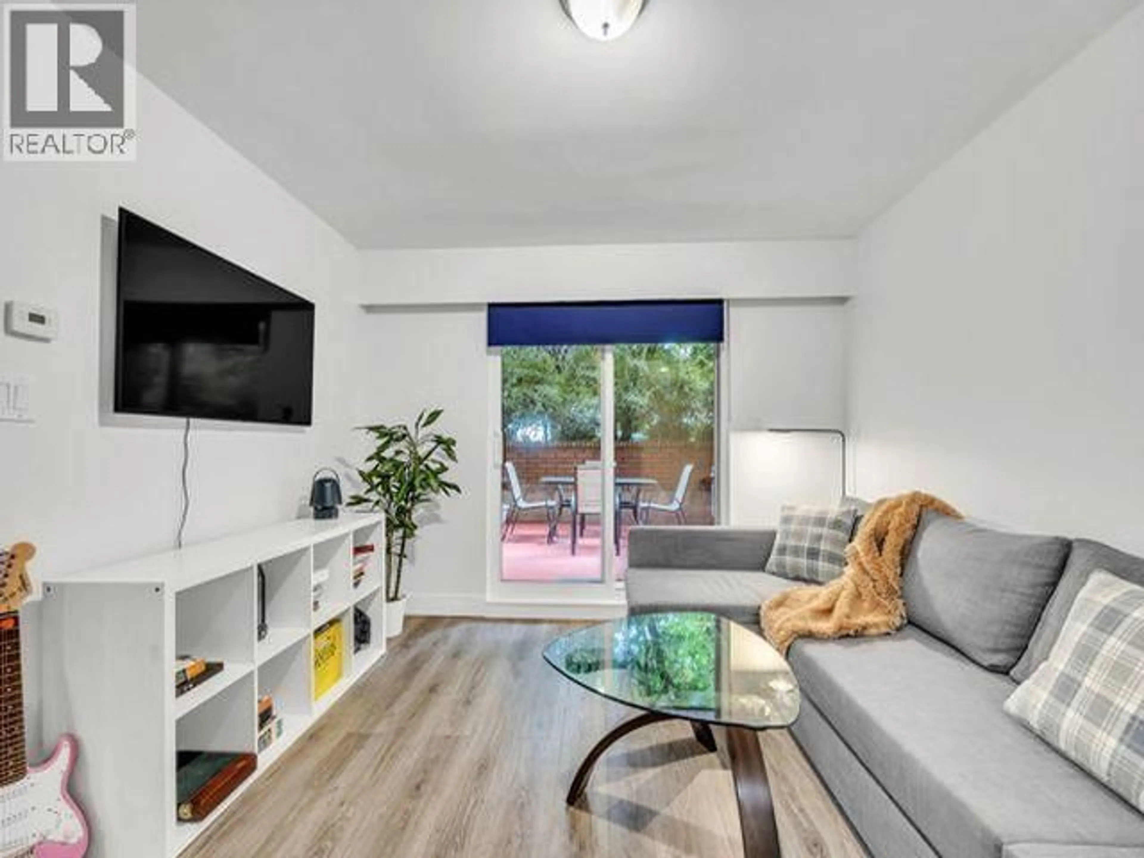 Living room with furniture, wood/laminate floor for 107 - 215 TEMPLETON DRIVE, Vancouver British Columbia V5L3E3