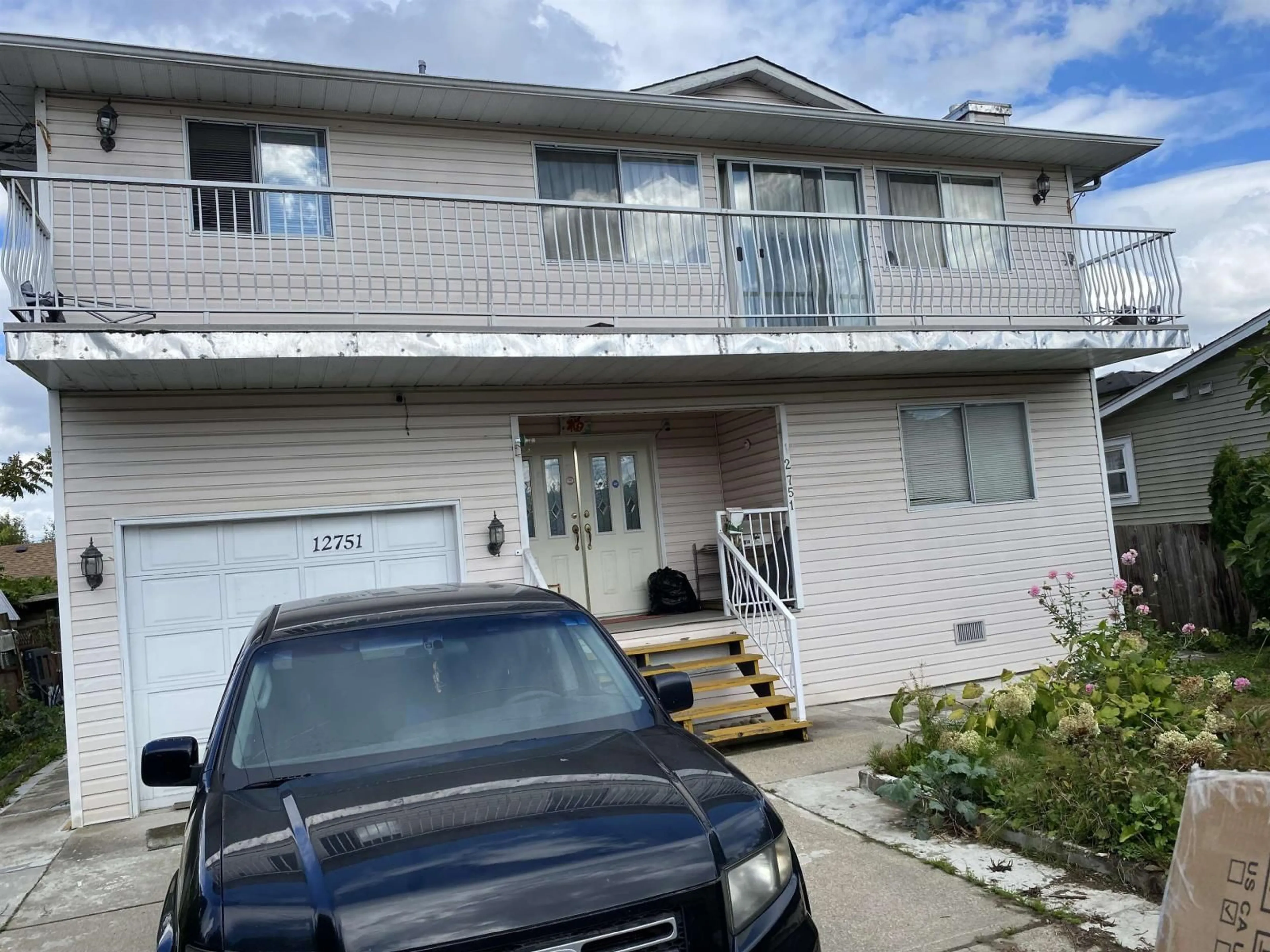 Home with vinyl exterior material, street for 12751 115A, Surrey British Columbia V3V3R3