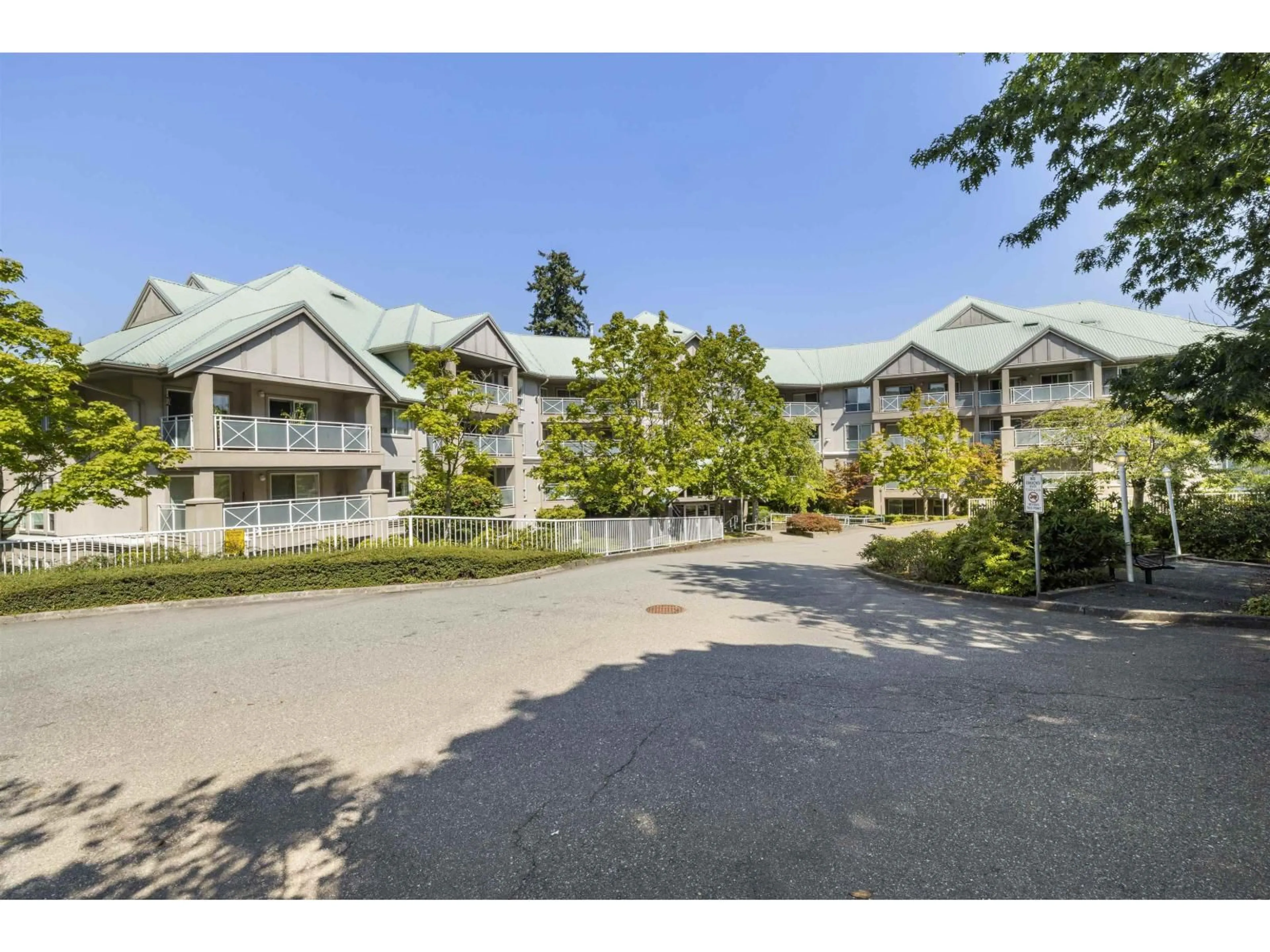 A pic from outside/outdoor area/front of a property/back of a property/a pic from drone, mountain view for 310 - 15150 29A, Surrey British Columbia V4P3B1