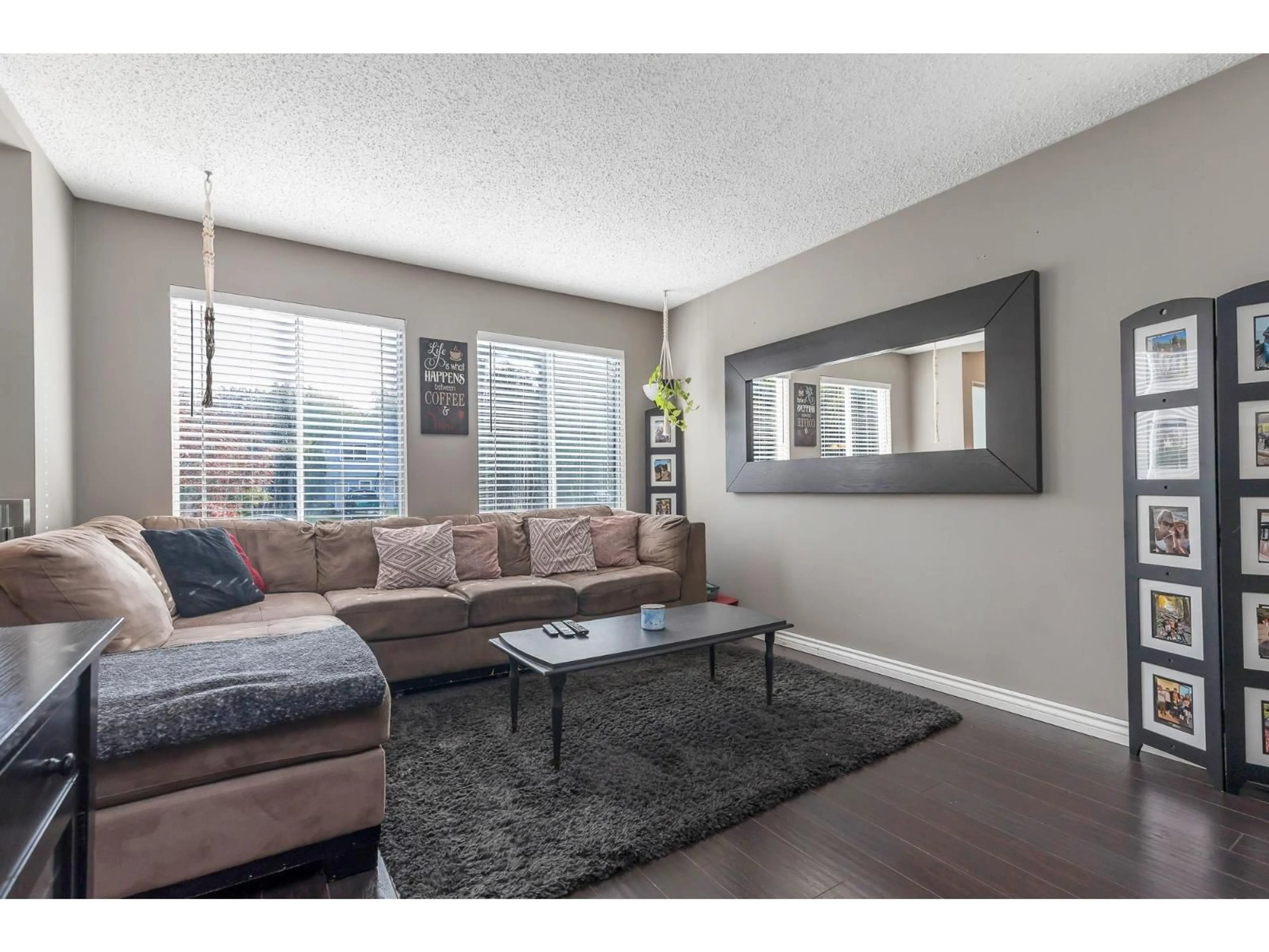 Living room with furniture, wood/laminate floor for 3419 JUNIPER, Abbotsford British Columbia V2S7V2