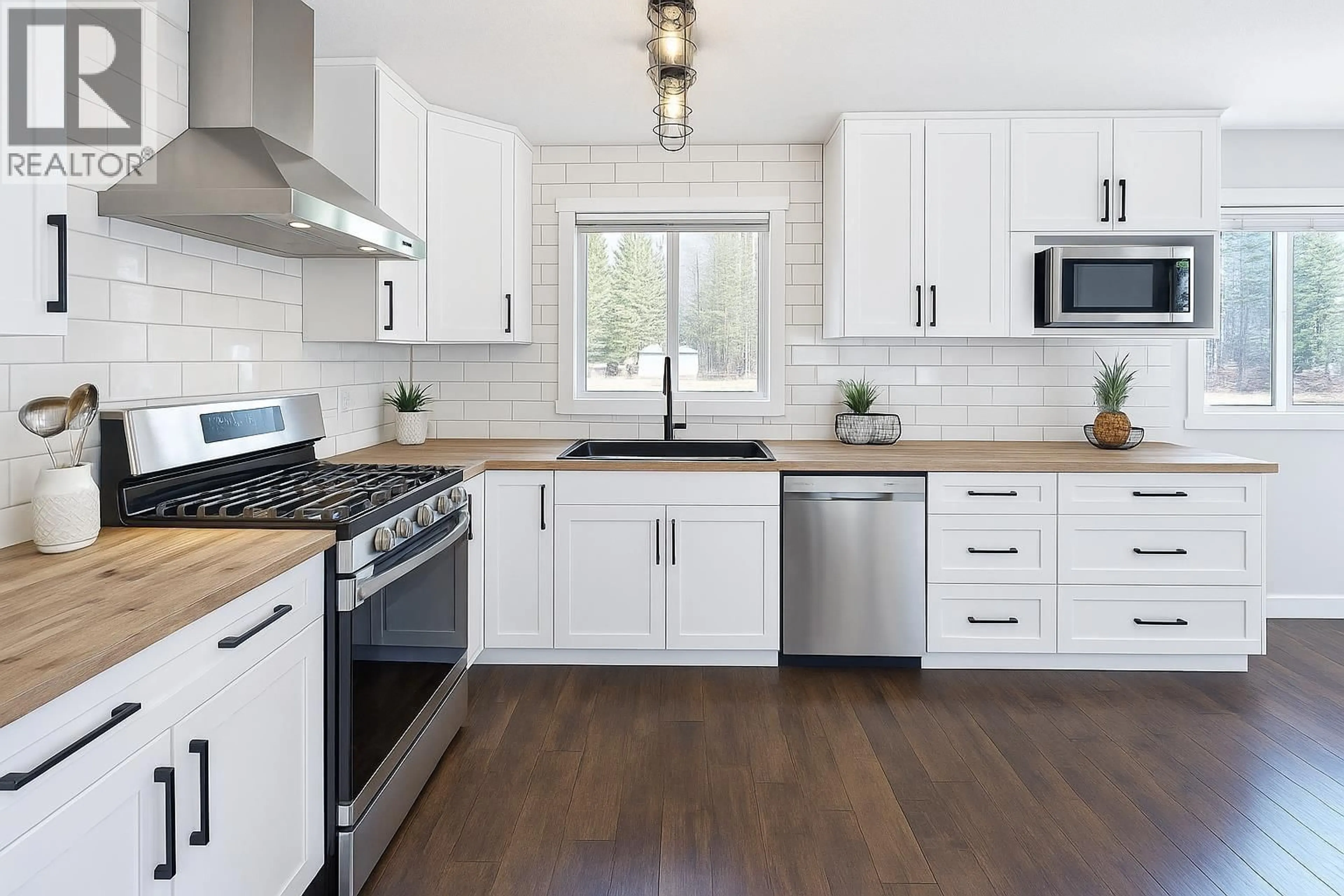 Open concept kitchen, wood/laminate floor for 6353 NORTH NECHAKO ROAD, Prince George British Columbia V2K4Z2
