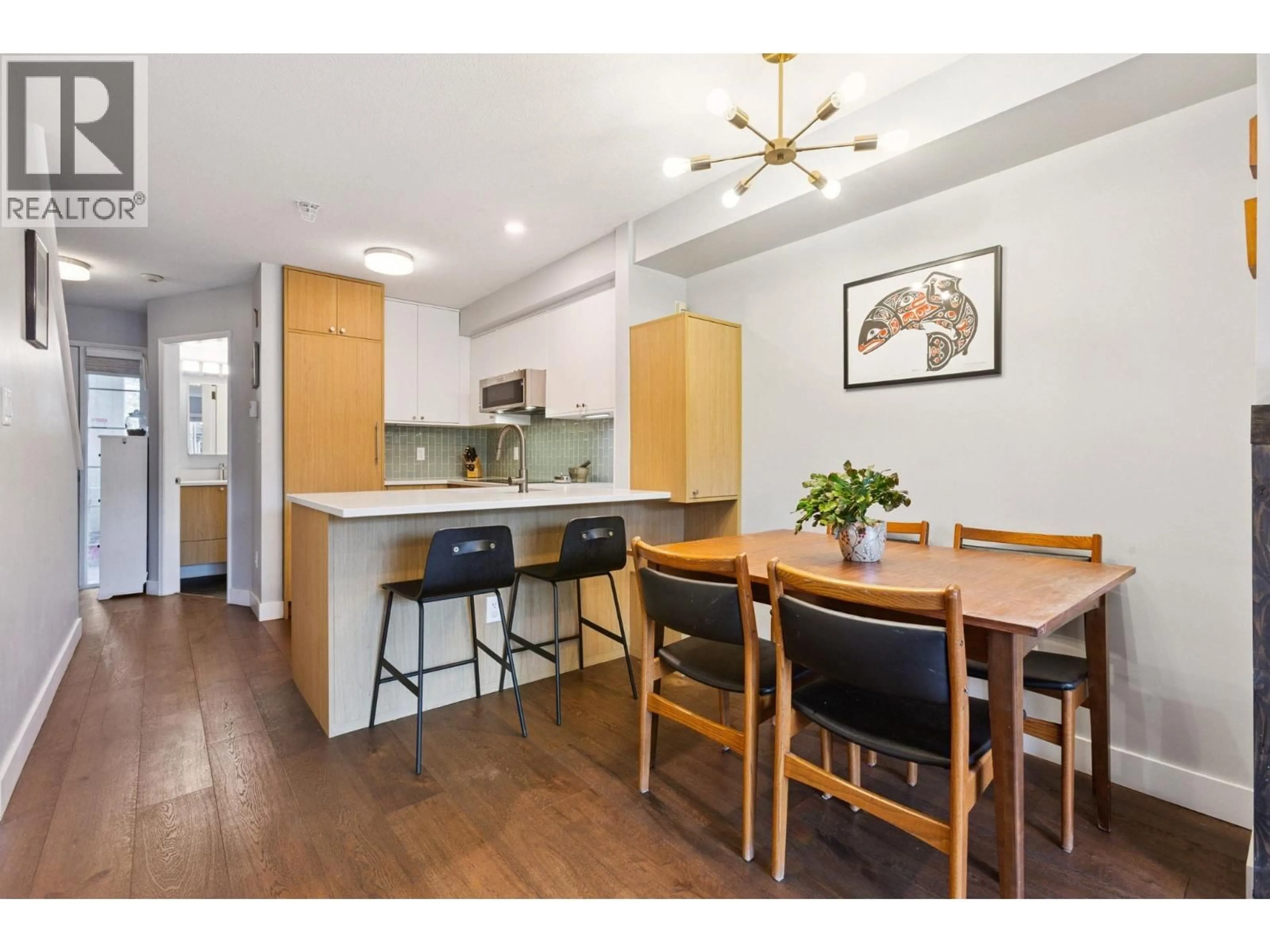 Open concept kitchen, wood/laminate floor for 314 - 2565 BROADWAY STREET, Vancouver British Columbia V6K2E9