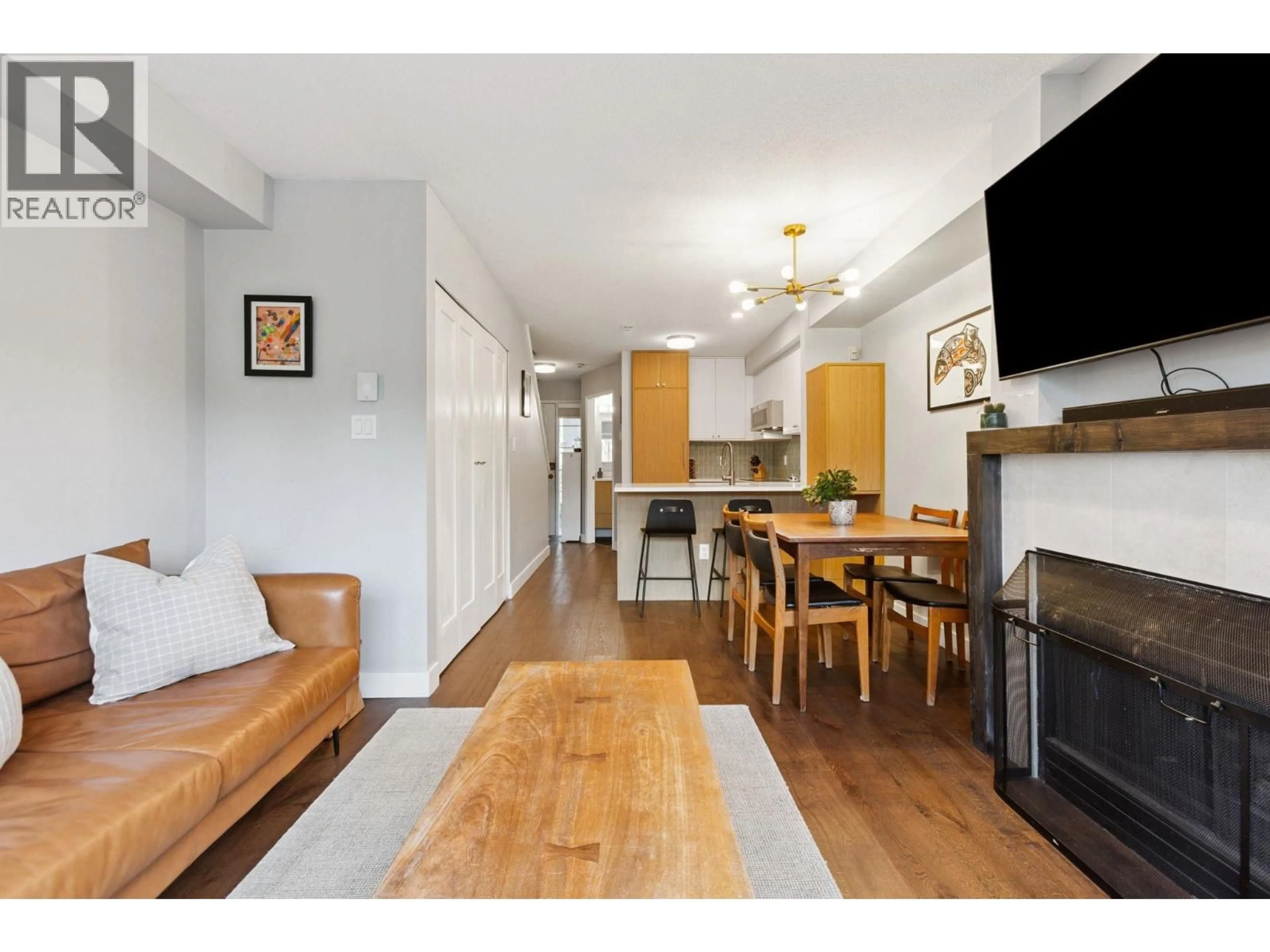 Living room with furniture, wood/laminate floor for 314 - 2565 BROADWAY STREET, Vancouver British Columbia V6K2E9