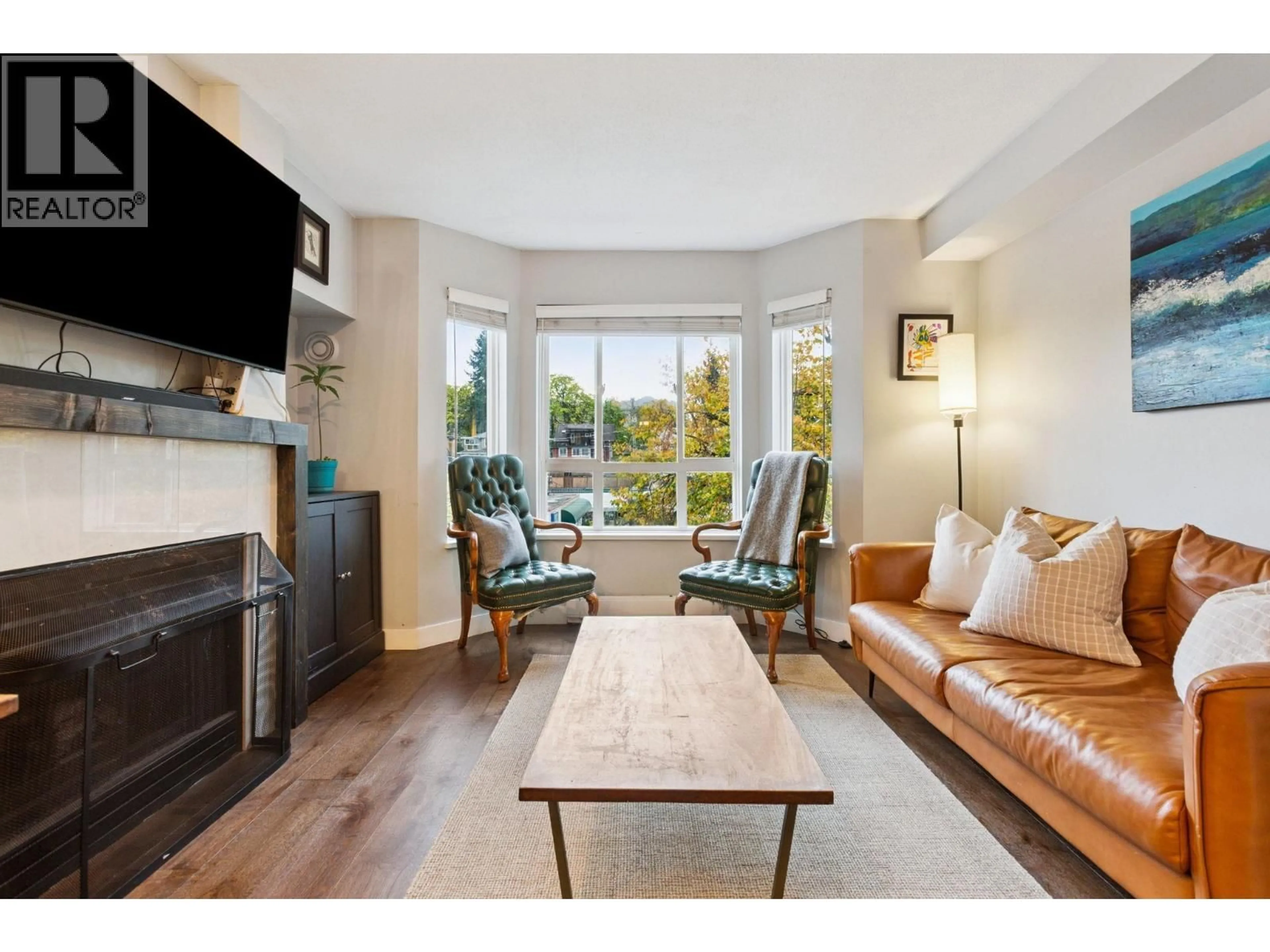 Living room with furniture, wood/laminate floor for 314 - 2565 BROADWAY STREET, Vancouver British Columbia V6K2E9