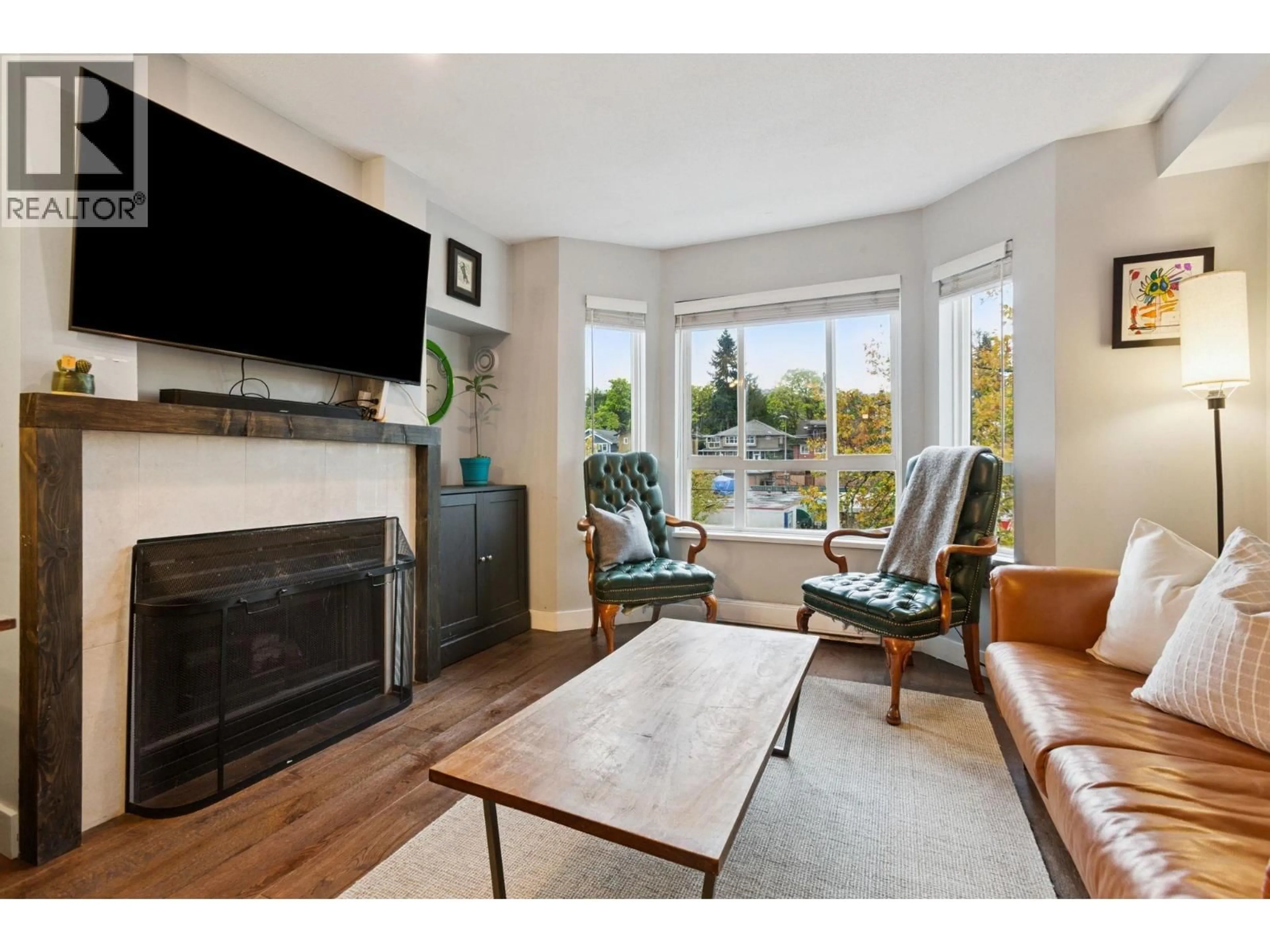 Living room with furniture, wood/laminate floor for 314 - 2565 BROADWAY STREET, Vancouver British Columbia V6K2E9