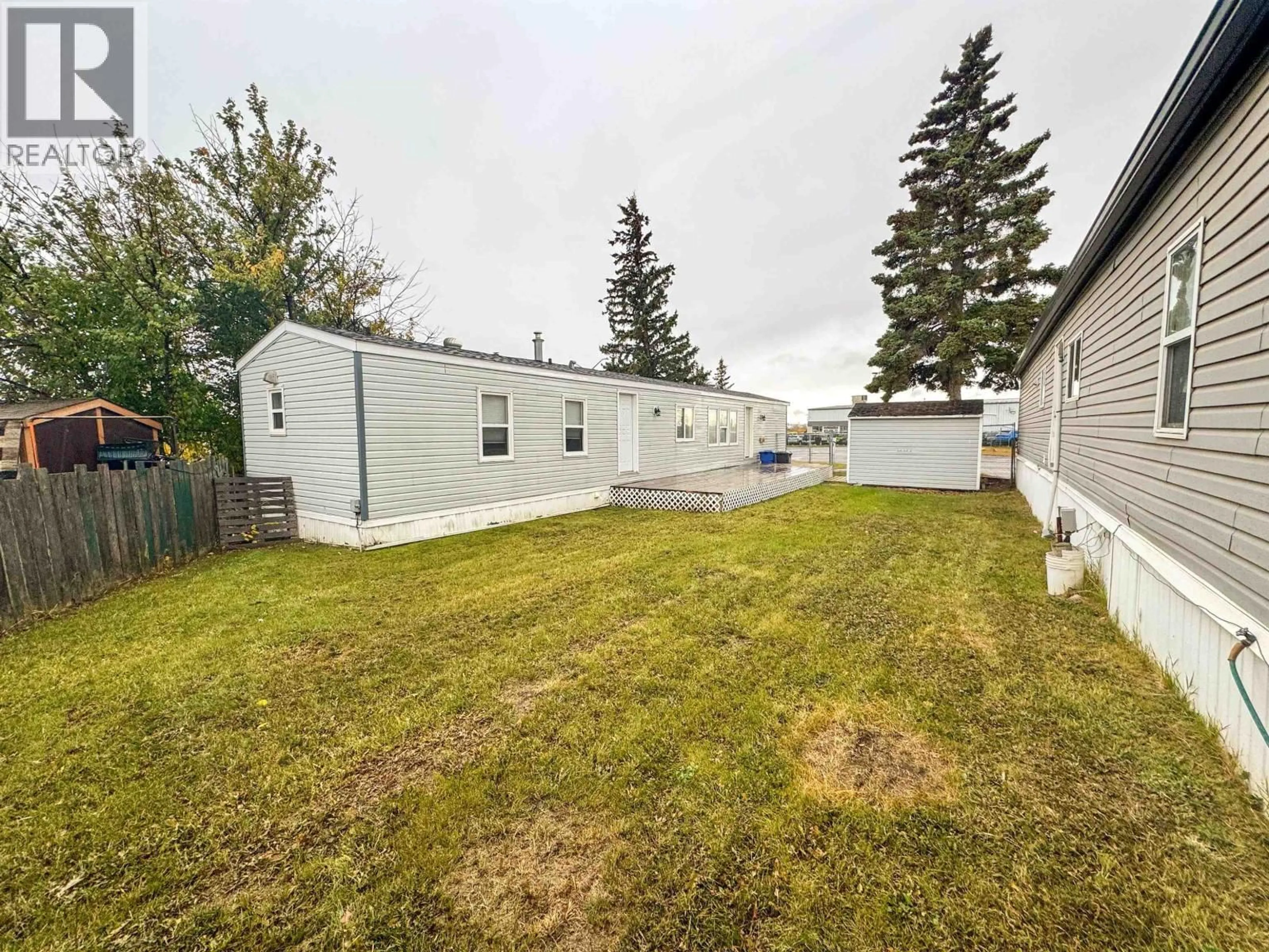 A pic from outside/outdoor area/front of a property/back of a property/a pic from drone, street for 22 - 8420 ALASKA ROAD, Fort St. John British Columbia V1J4J6