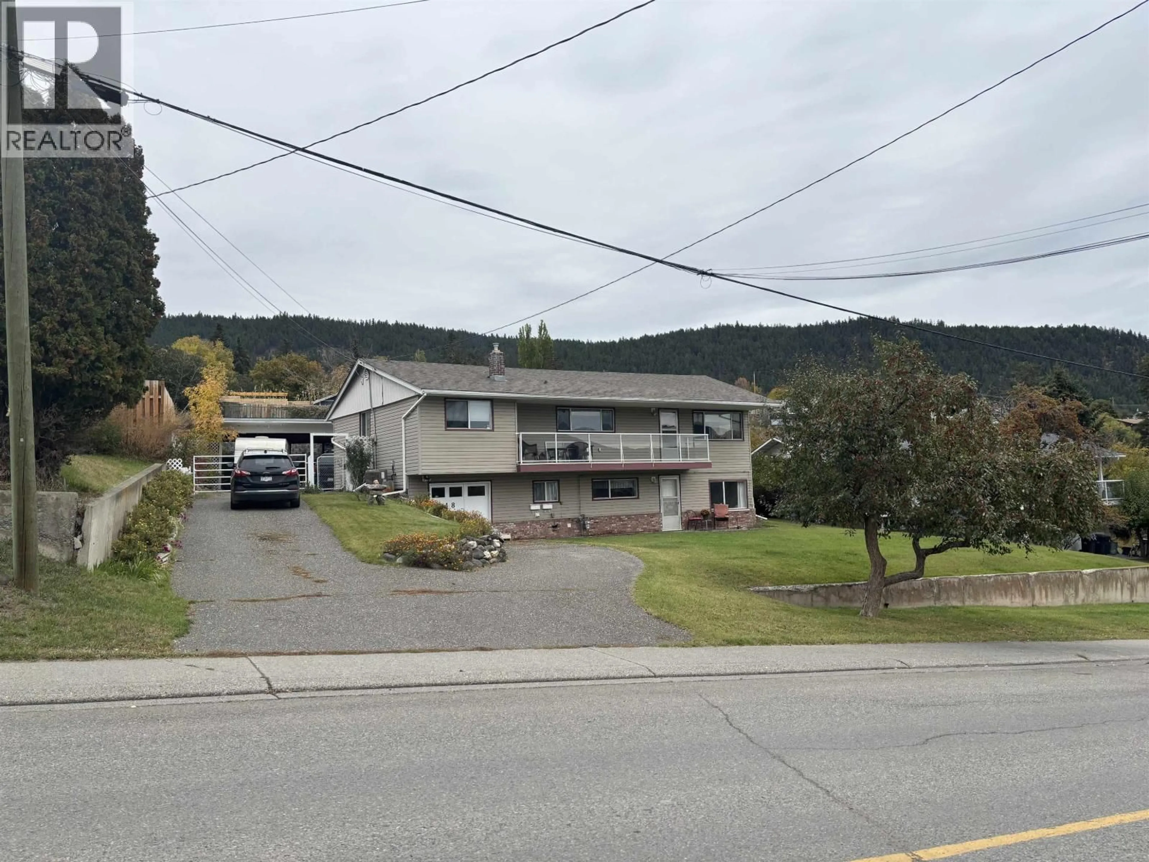 A pic from outside/outdoor area/front of a property/back of a property/a pic from drone, mountain view for 448 SIXTH AVENUE, Williams Lake British Columbia V2G2G7