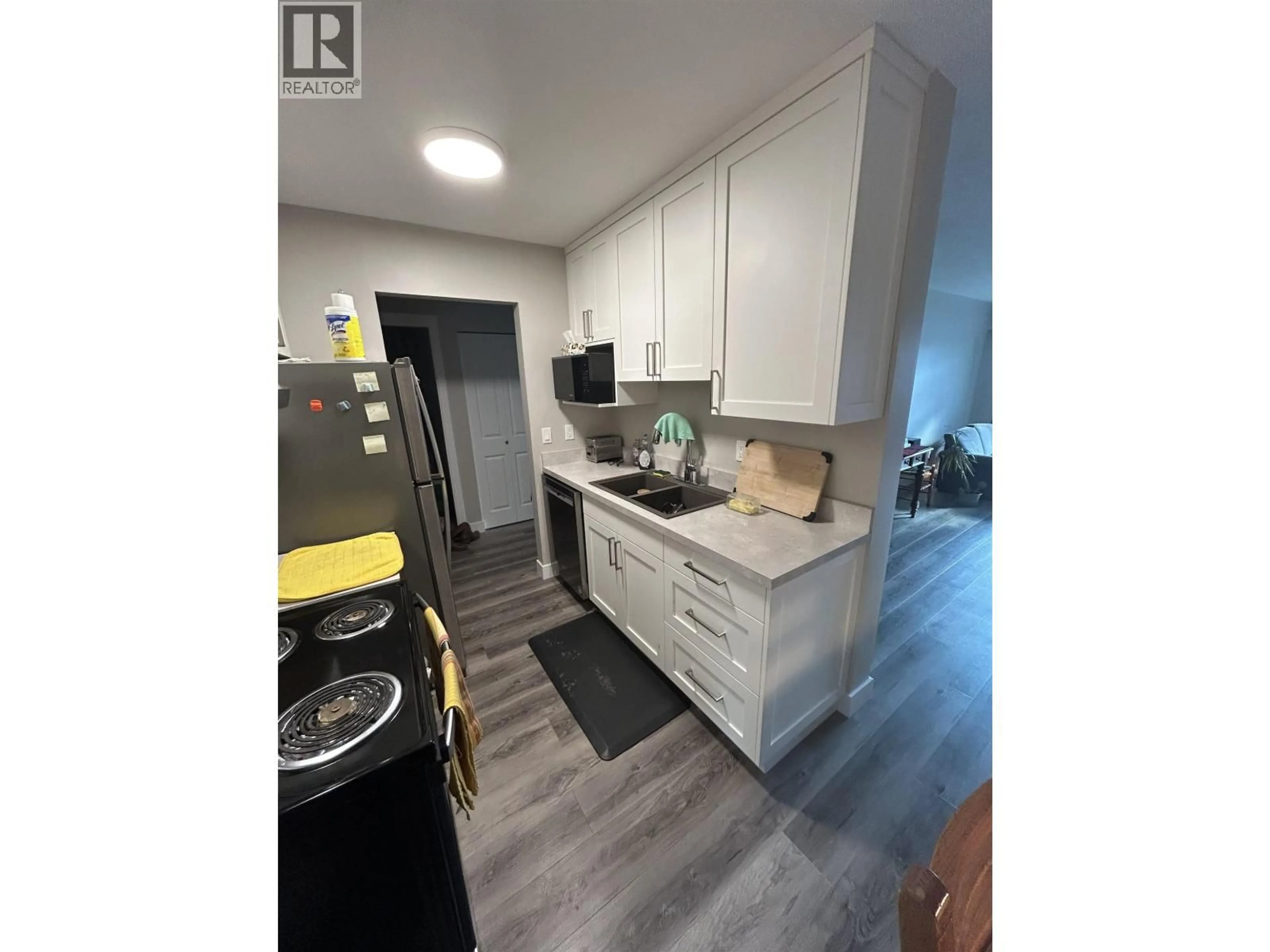 Open concept kitchen, wood/laminate floor for 304 - 1654 10TH AVENUE, Prince George British Columbia V2L3S4