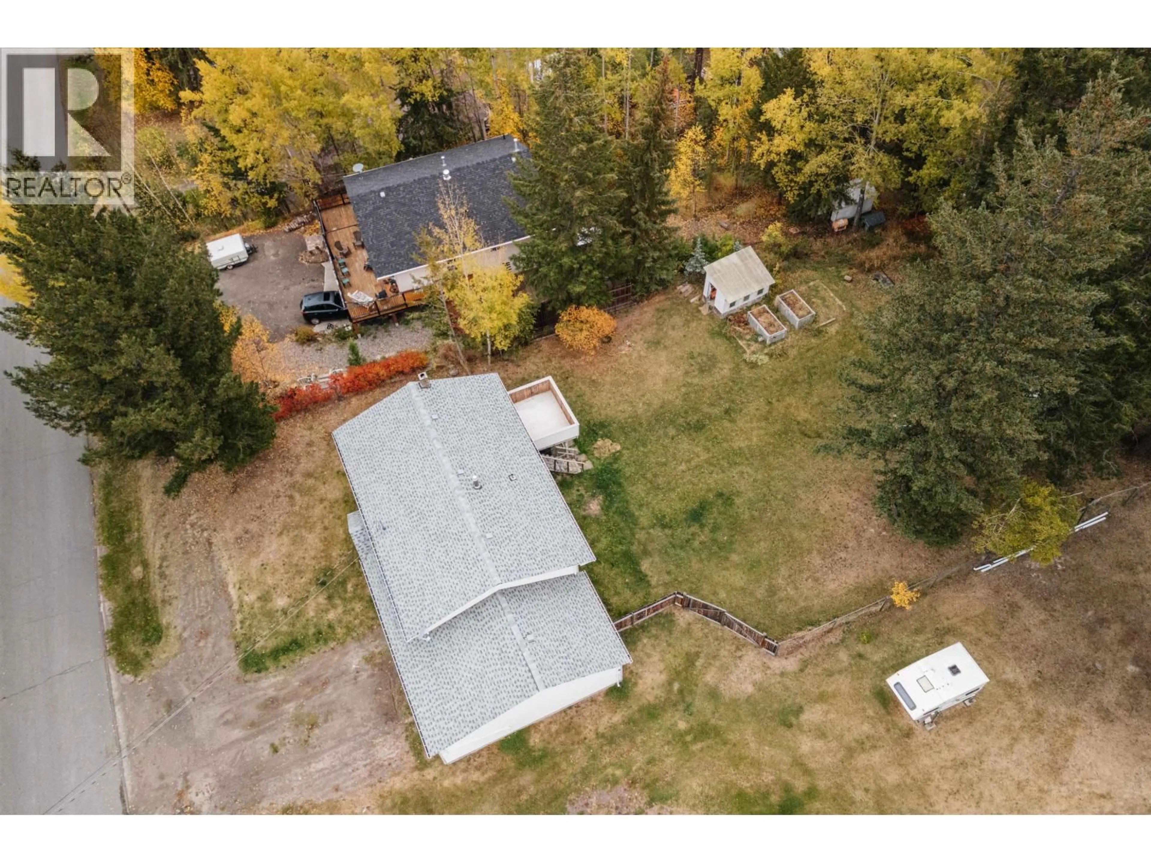 A pic from outside/outdoor area/front of a property/back of a property/a pic from drone, unknown for 835 SPRUCE AVENUE, 100 Mile House British Columbia V0K2E0
