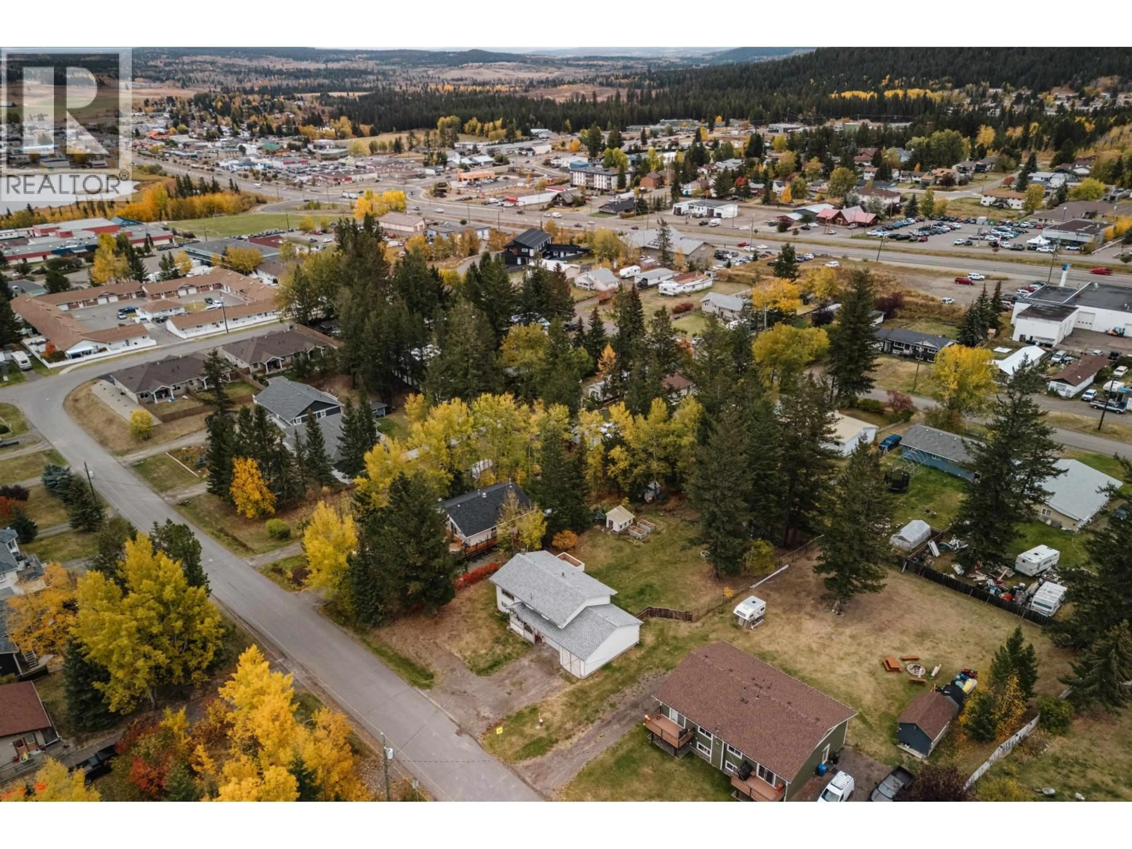 A pic from outside/outdoor area/front of a property/back of a property/a pic from drone, mountain view for 835 SPRUCE AVENUE, 100 Mile House British Columbia V0K2E0
