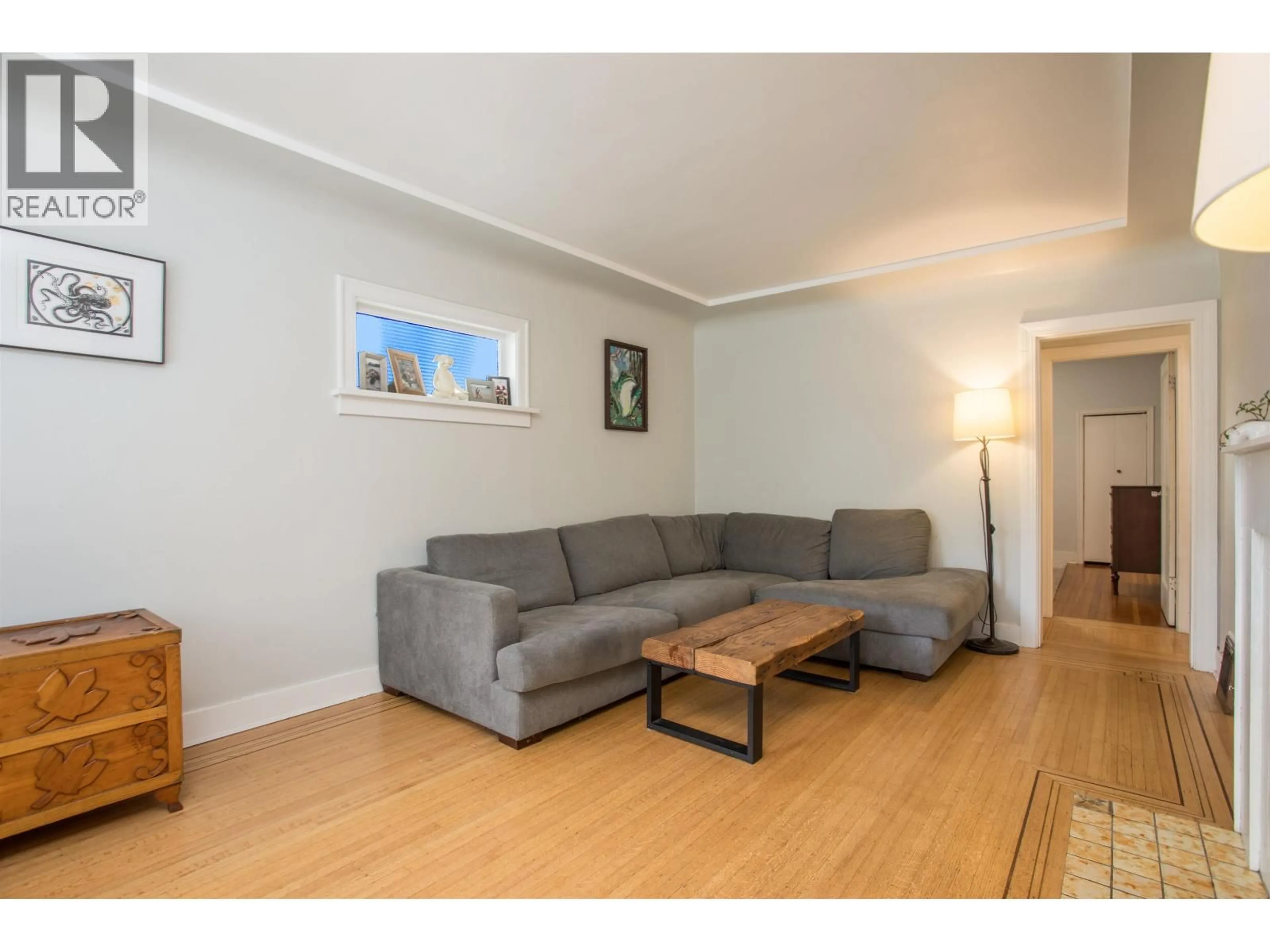 Living room with furniture, wood/laminate floor for 3566 11TH AVENUE, Vancouver British Columbia V6R2K2