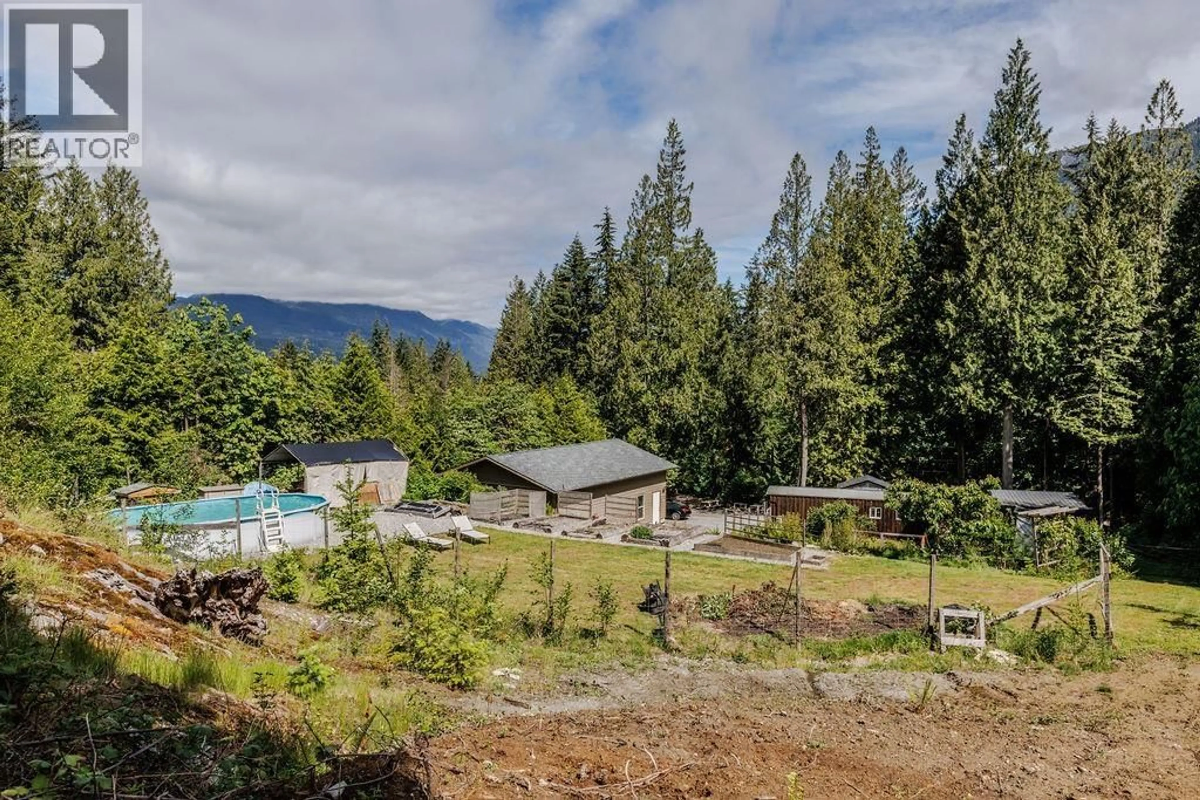 A pic from outside/outdoor area/front of a property/back of a property/a pic from drone, mountain view for 5751 TILLICUM BAY ROAD, Sechelt British Columbia V7Z0C7