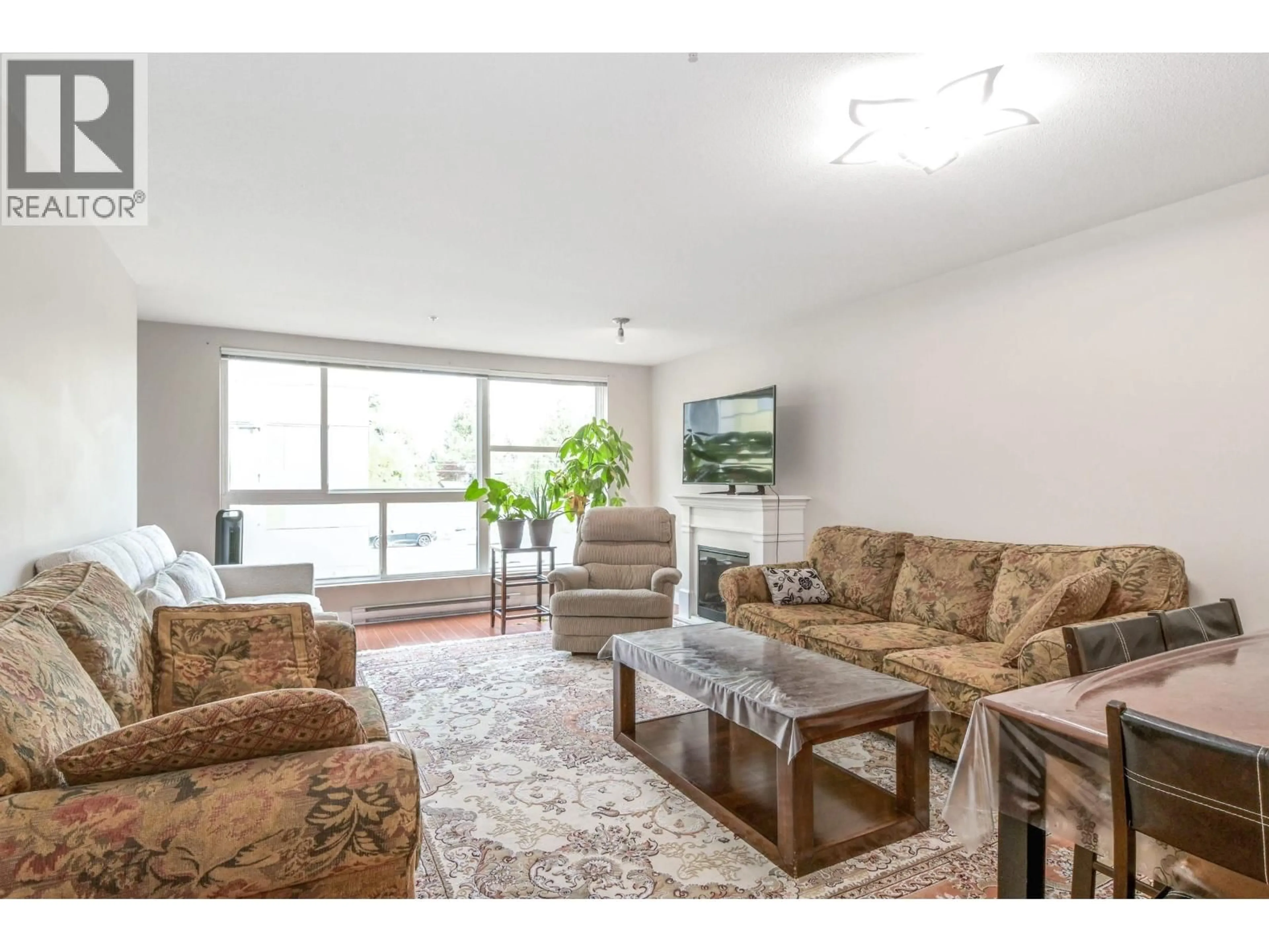 Living room with furniture, wood/laminate floor for 228 - 12085 228 STREET, Maple Ridge British Columbia V2X6M2