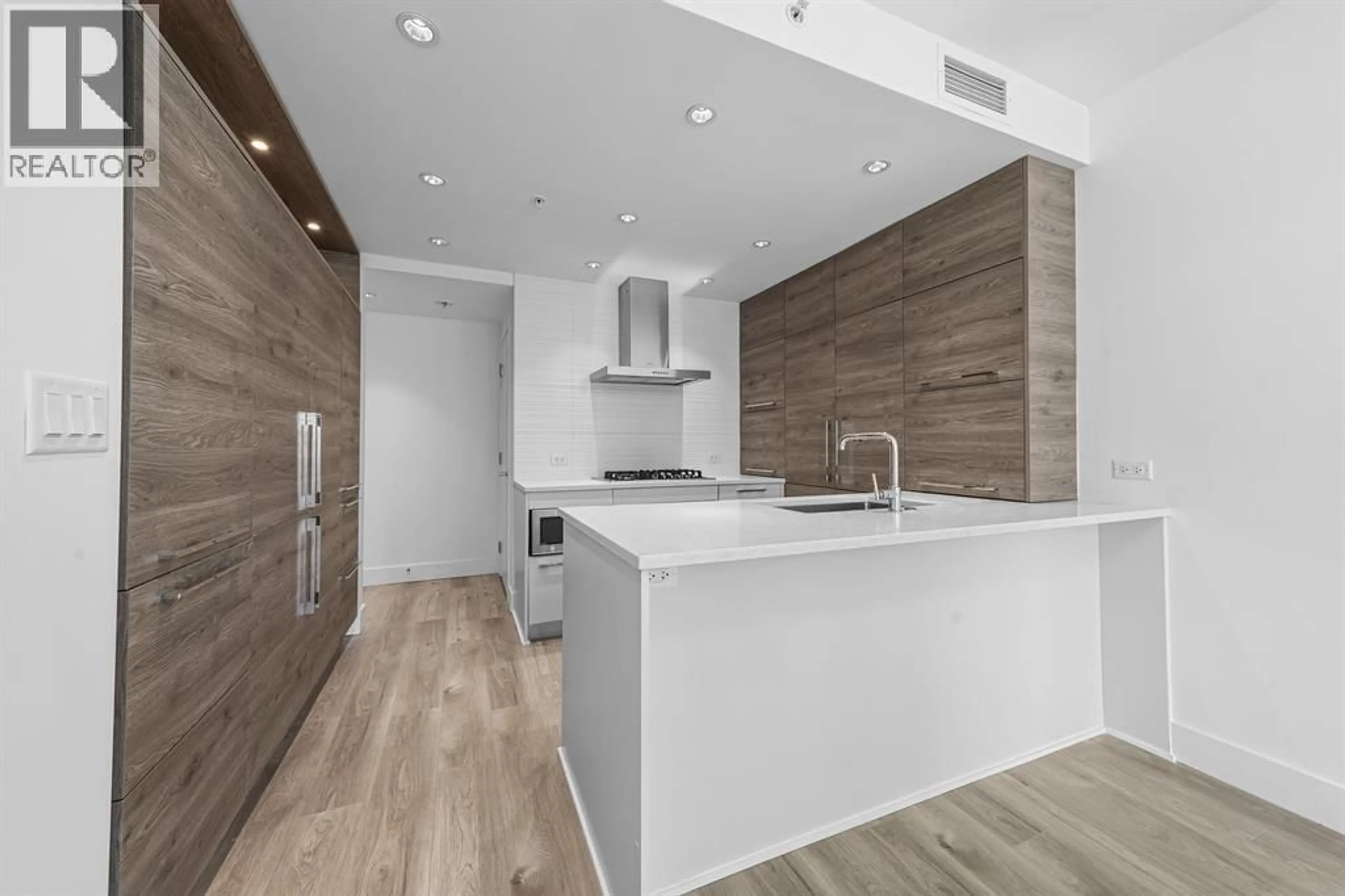 Open concept kitchen, wood/laminate floor for 1801 - 7303 NOBLE LANE, Burnaby British Columbia V3N0H2