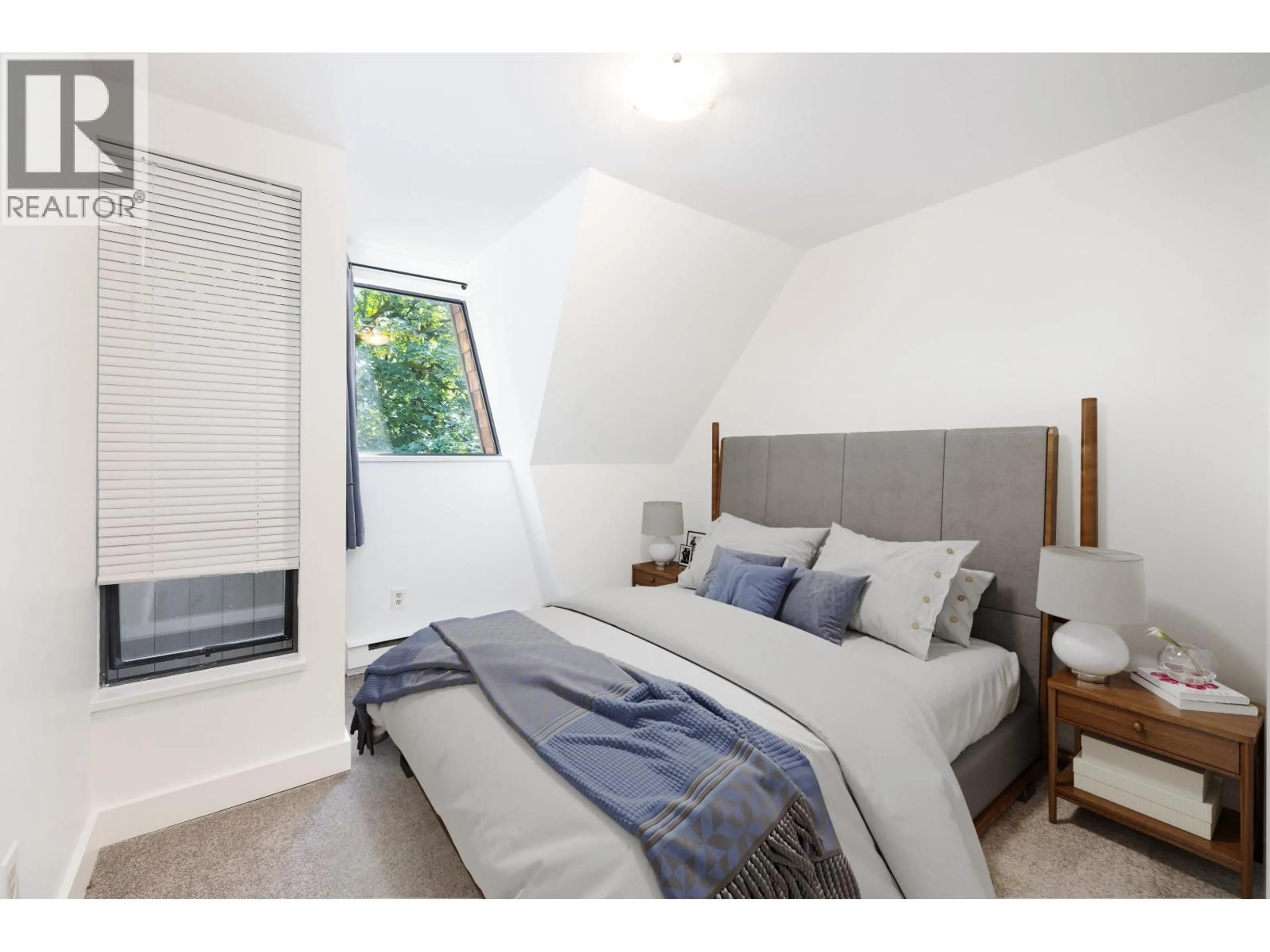 Bedroom with bed, wood/laminate floor for 3182 MOUNTAIN HIGHWAY, North Vancouver British Columbia V7K2H5