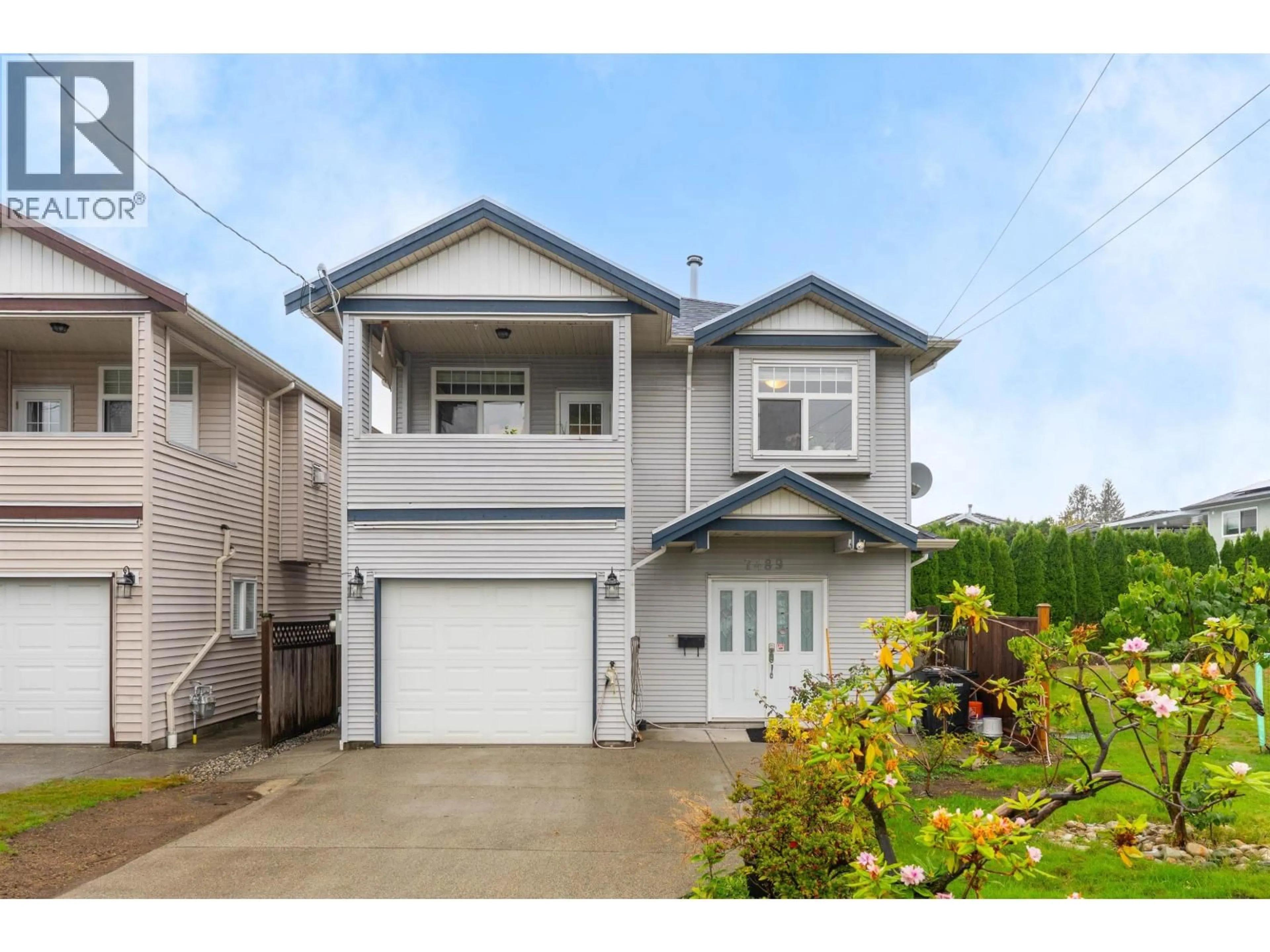 Home with vinyl exterior material, street for 7489 ROSEWOOD STREET, Burnaby British Columbia V5E2G6