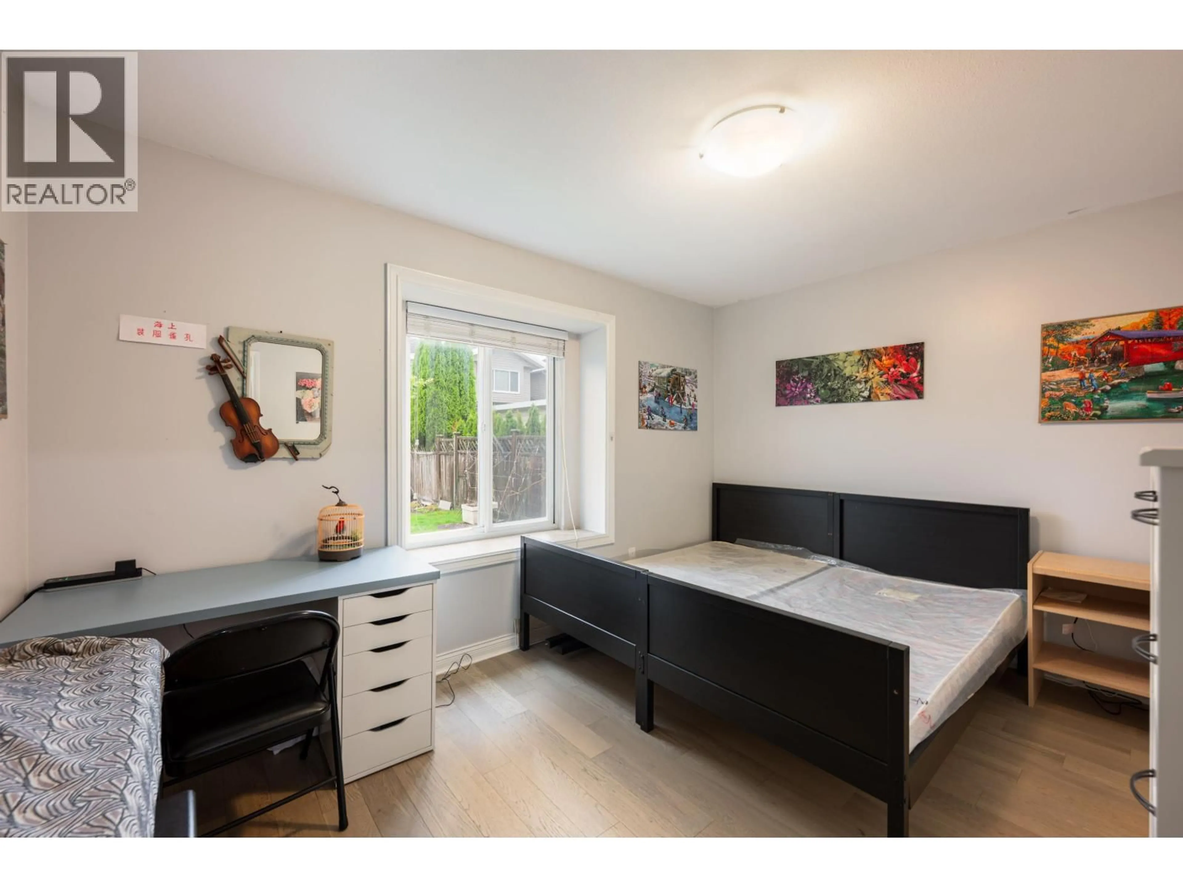 Bedroom with bed, wood/laminate floor for 7489 ROSEWOOD STREET, Burnaby British Columbia V5E2G6