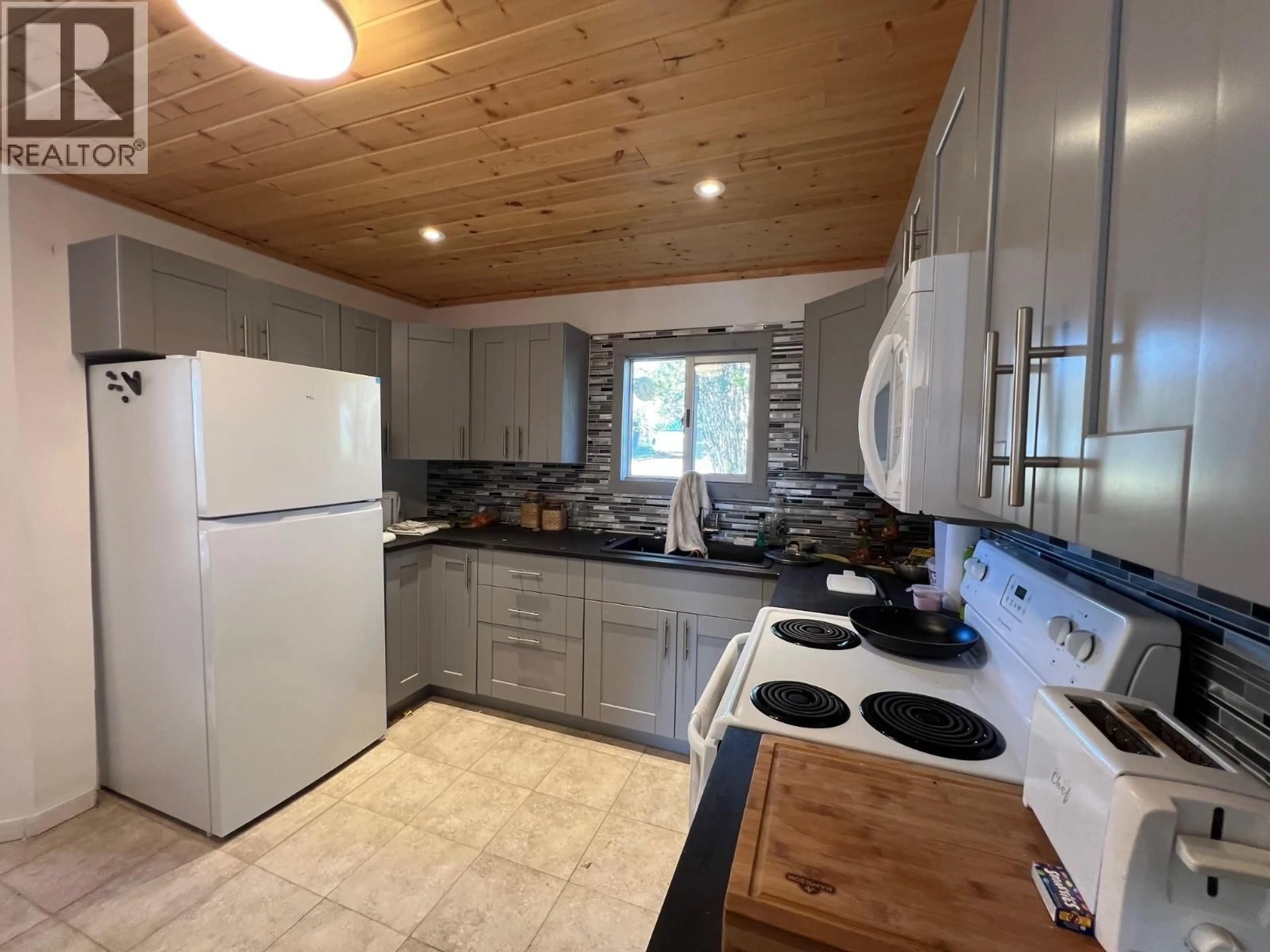 Standard kitchen, wood/laminate floor for 9201 CANYON DRIVE, Hudsons Hope British Columbia V0C1V0