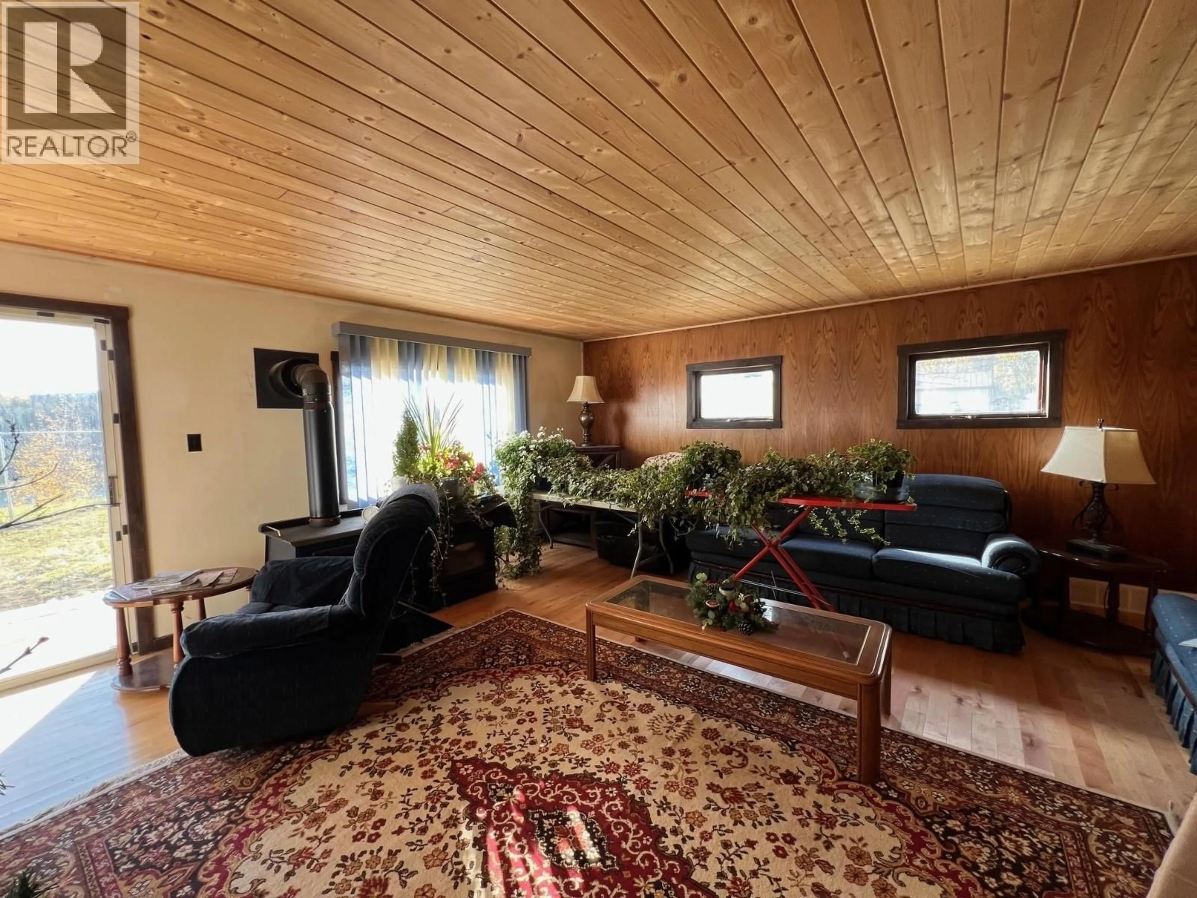Living room with furniture, wood/laminate floor for 9201 CANYON DRIVE, Hudsons Hope British Columbia V0C1V0