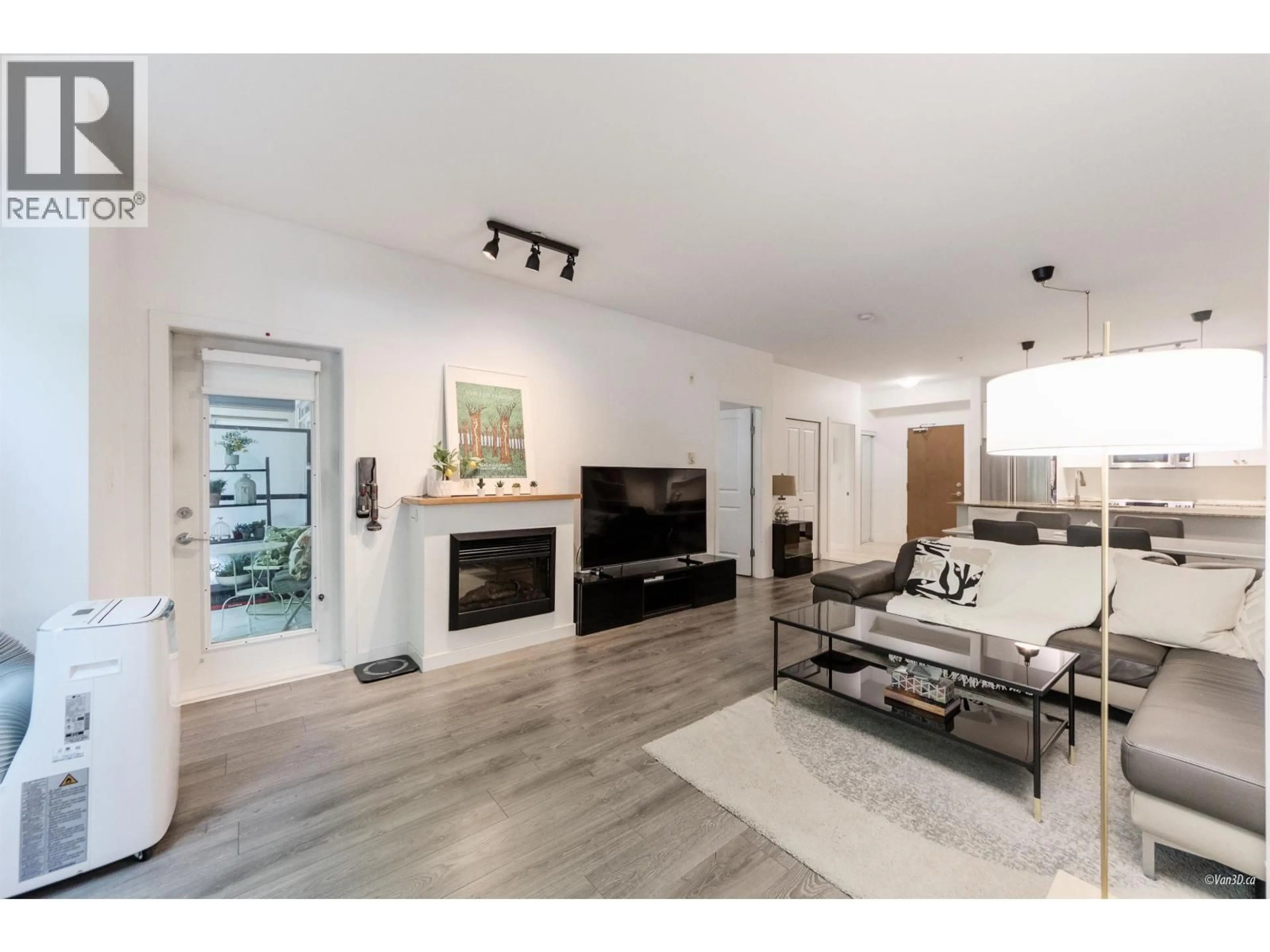 Living room with furniture, wood/laminate floor for 108 - 290 FRANCIS WAY, New Westminster British Columbia V3L0C4