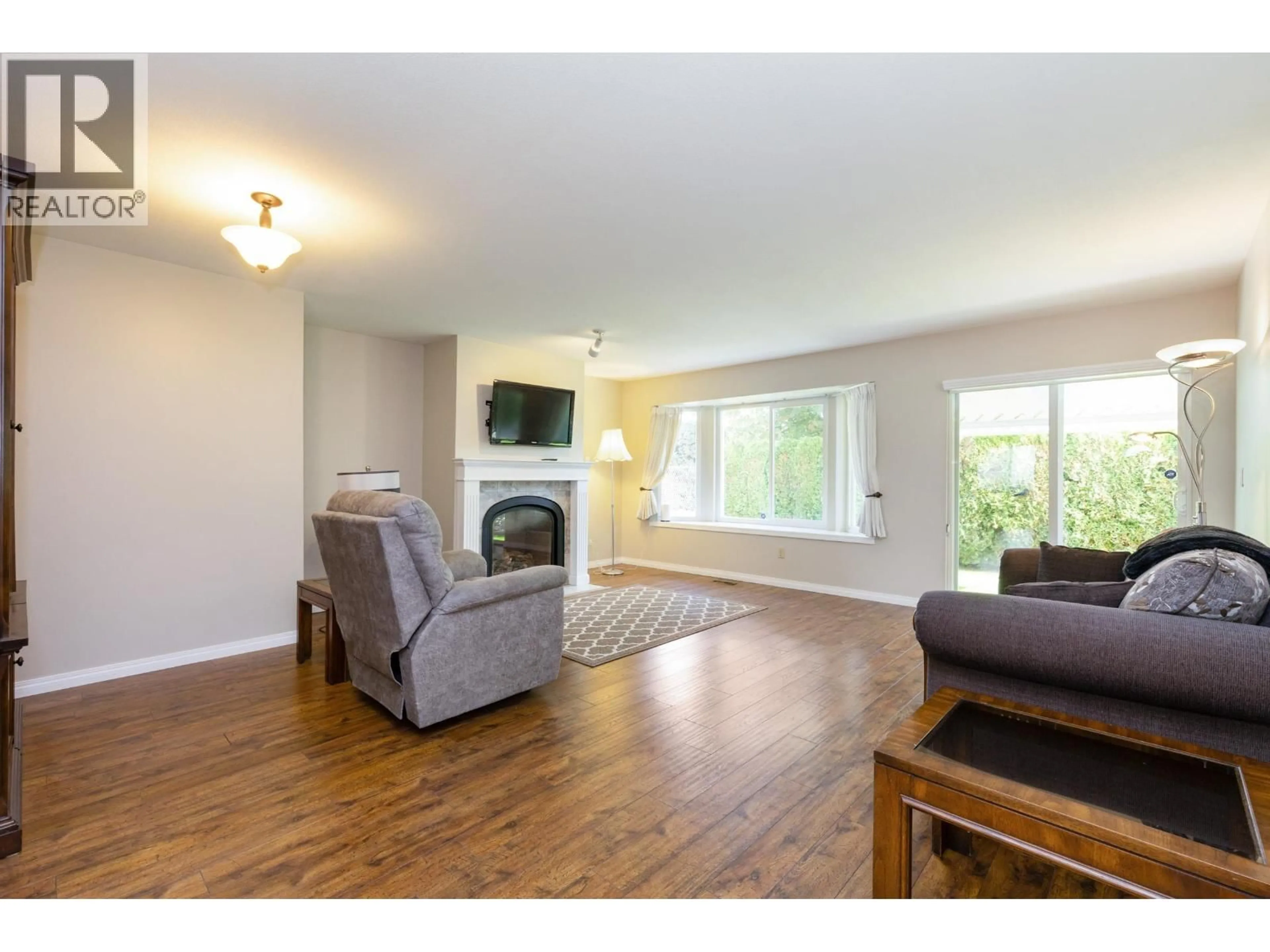 Living room with furniture, wood/laminate floor for 3 - 19171 MITCHELL ROAD, Pitt Meadows British Columbia V3Y2G3