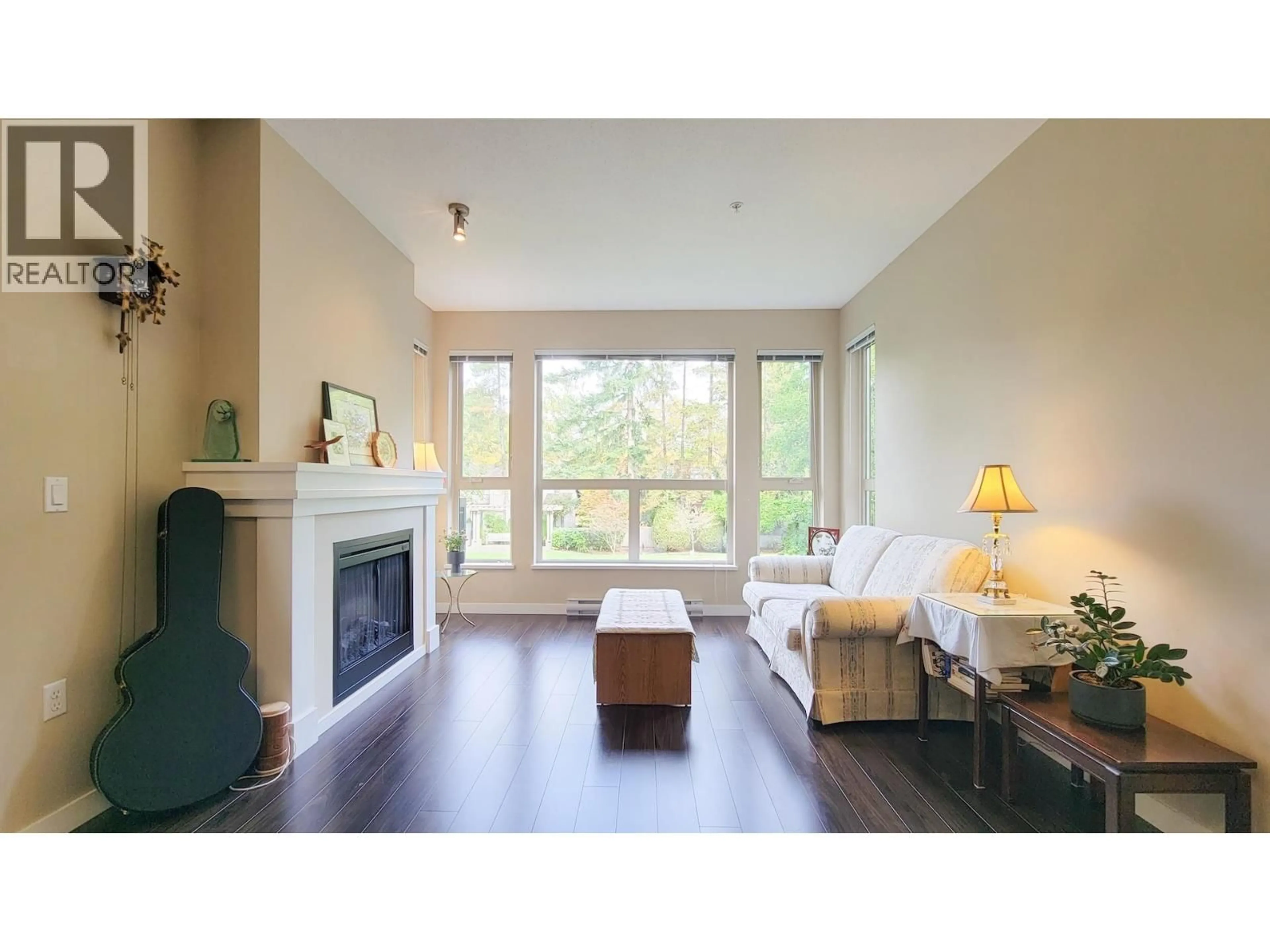 Living room with furniture, wood/laminate floor for 204 - 1150 KENSAL PLACE, Coquitlam British Columbia V3B0H4