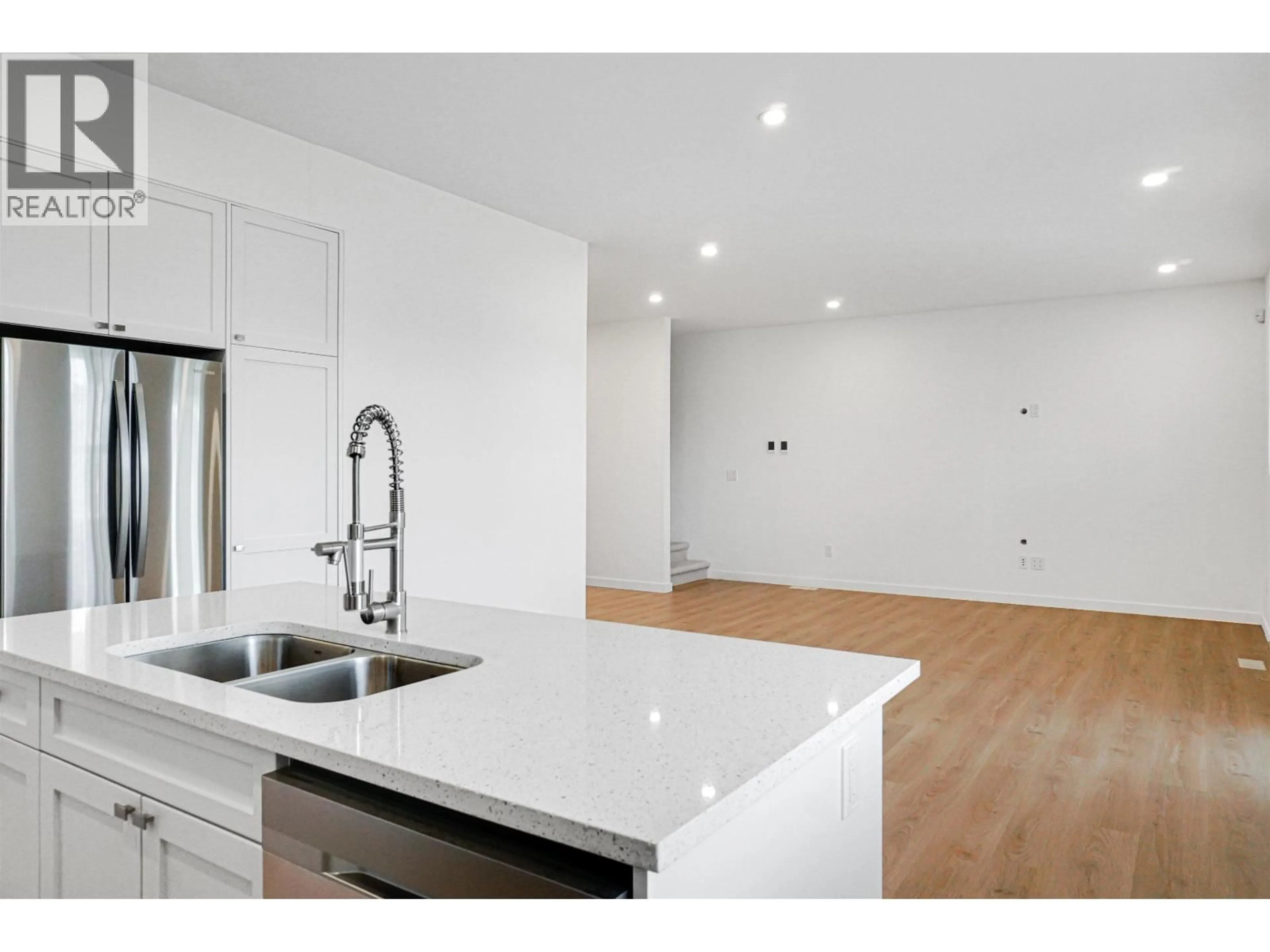 Open concept kitchen, wood/laminate floor for 64 WOZNEY STREET, Kitimat British Columbia V8C2S2