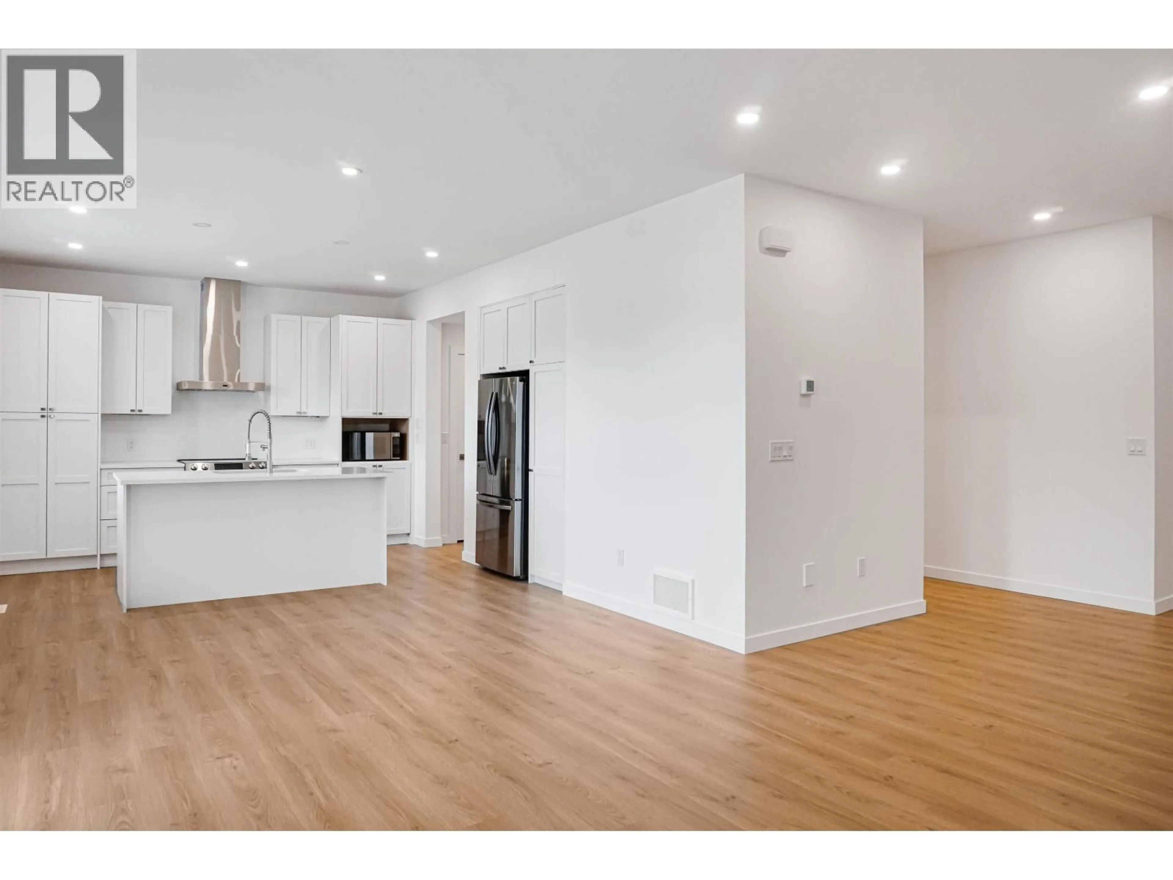 Open concept kitchen, wood/laminate floor for 64 WOZNEY STREET, Kitimat British Columbia V8C2S2