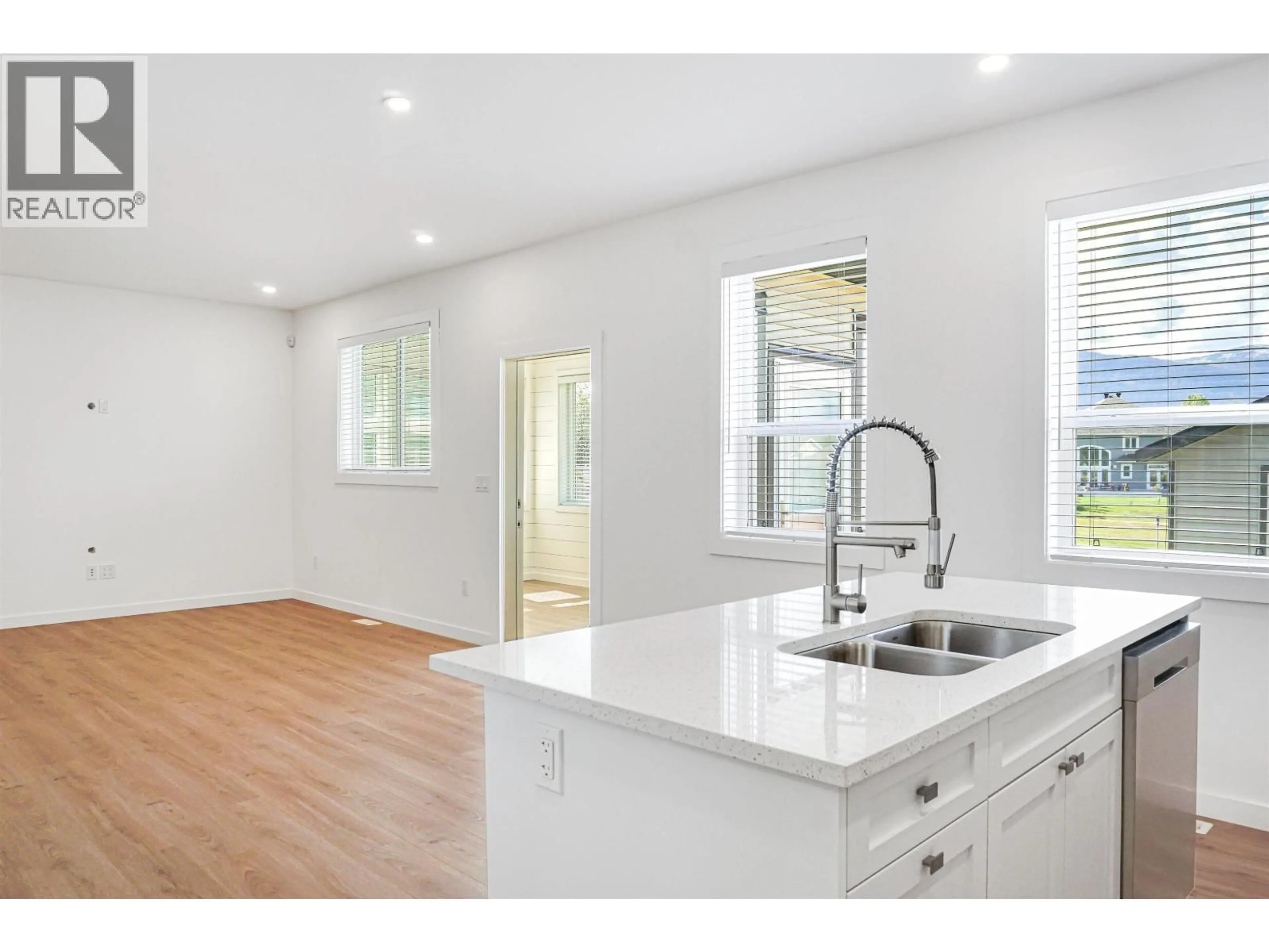 Open concept kitchen, wood/laminate floor for 64 WOZNEY STREET, Kitimat British Columbia V8C2S2