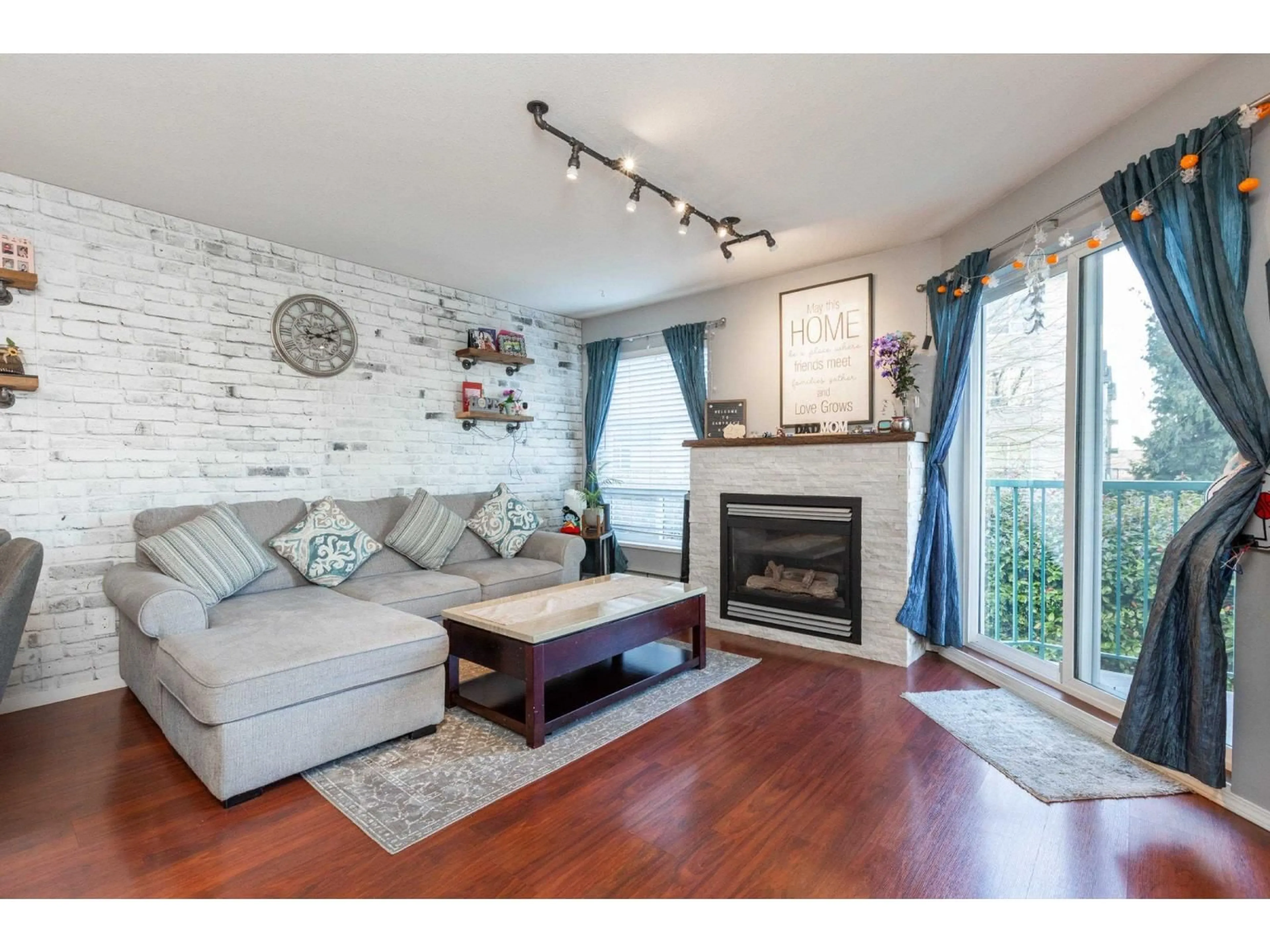Living room with furniture, wood/laminate floor for 209 - 2435 CENTER, Abbotsford British Columbia V2T2N4