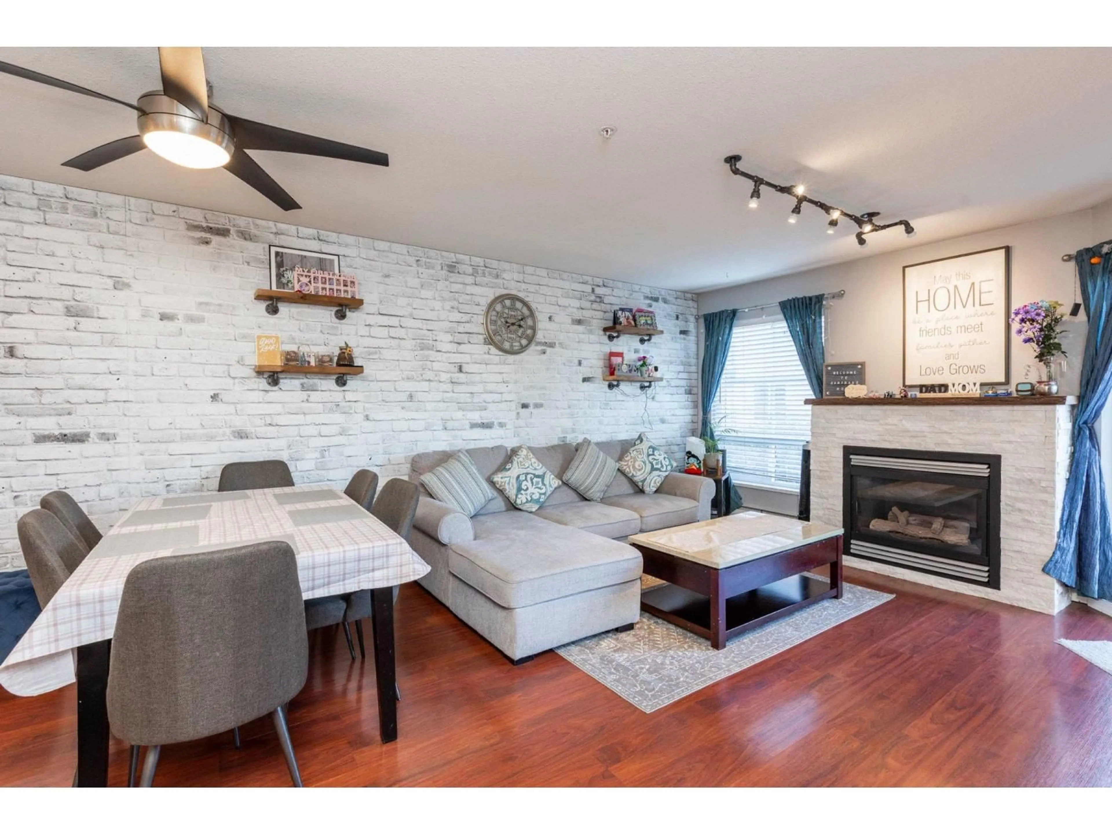 Living room with furniture, wood/laminate floor for 209 - 2435 CENTER, Abbotsford British Columbia V2T2N4