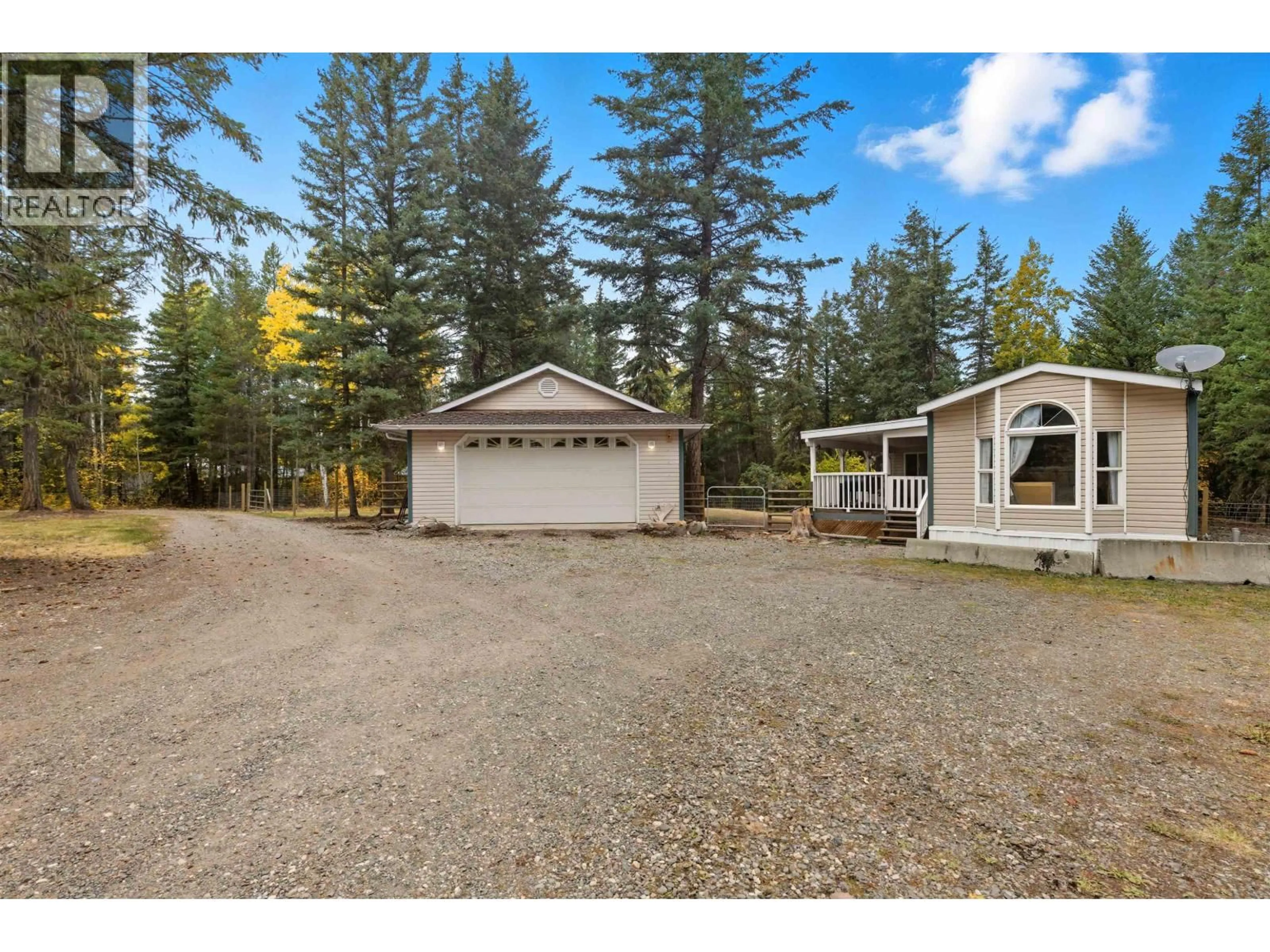 A pic from outside/outdoor area/front of a property/back of a property/a pic from drone, unknown for 3075 HEINIE PLACE, 150 Mile House British Columbia V2G1Z6