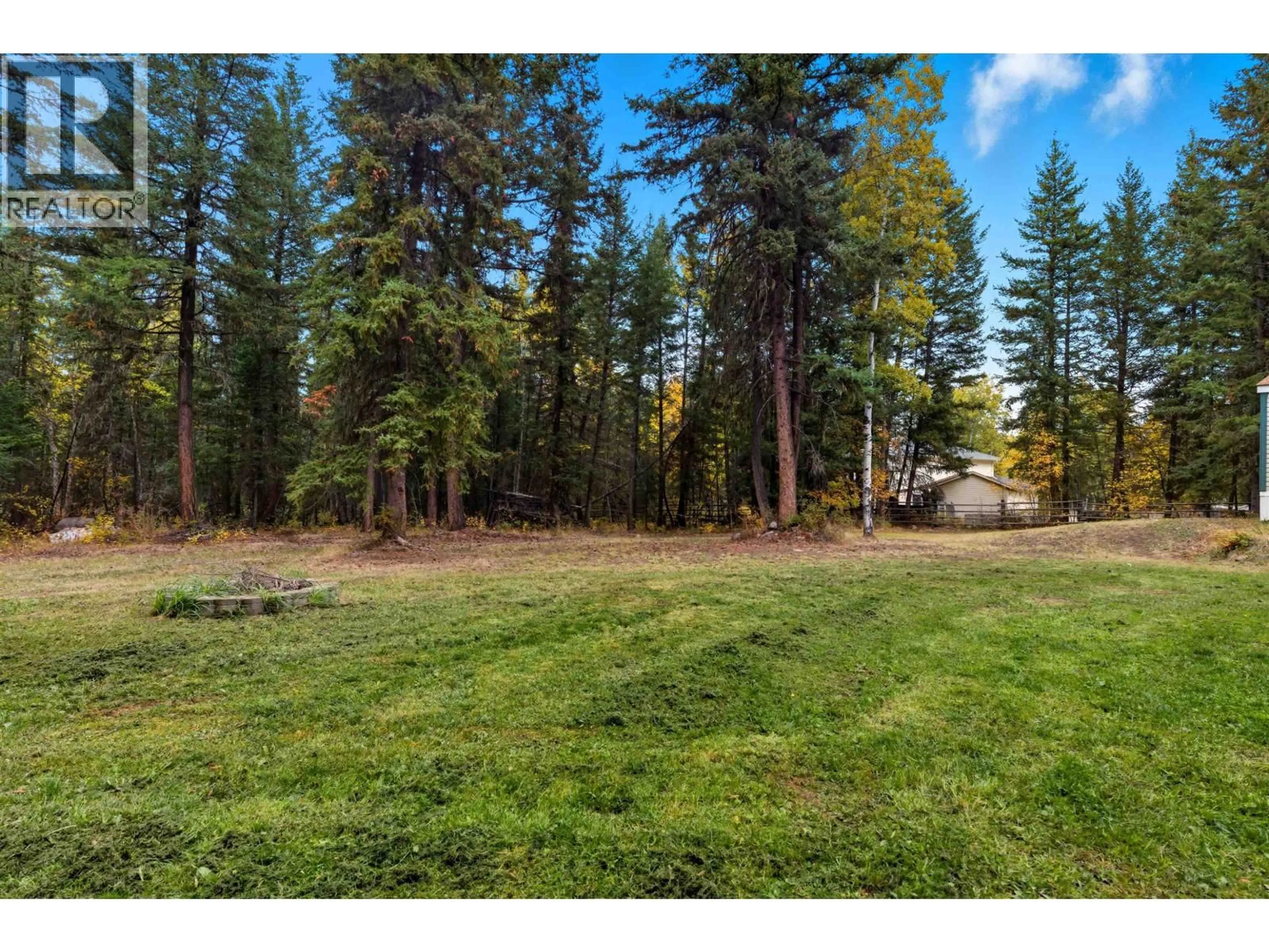 A pic from outside/outdoor area/front of a property/back of a property/a pic from drone, forest/trees view for 3075 HEINIE PLACE, 150 Mile House British Columbia V2G1Z6