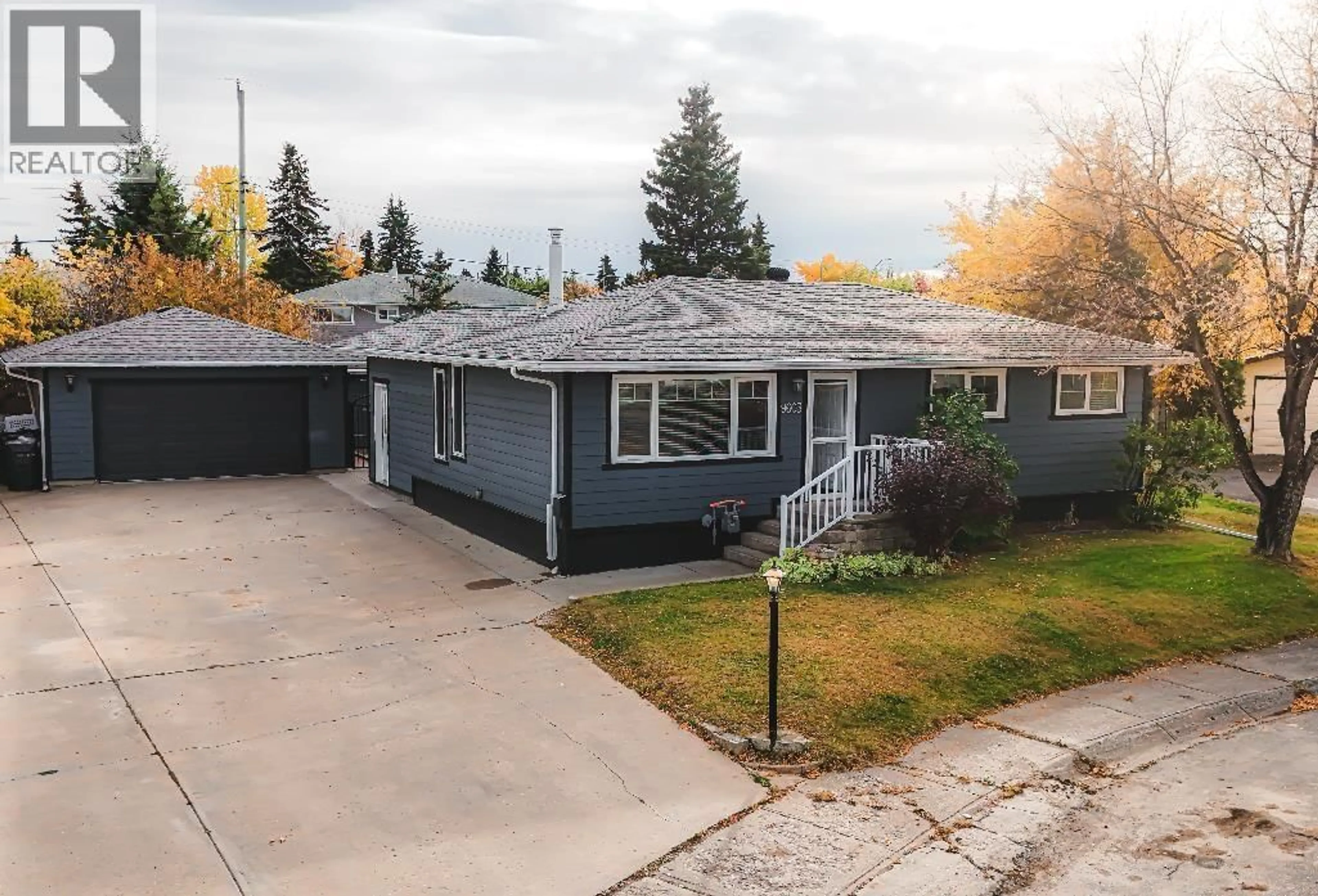 A pic from outside/outdoor area/front of a property/back of a property/a pic from drone, street for 9603 111 AVENUE, Fort St. John British Columbia V1J2T9