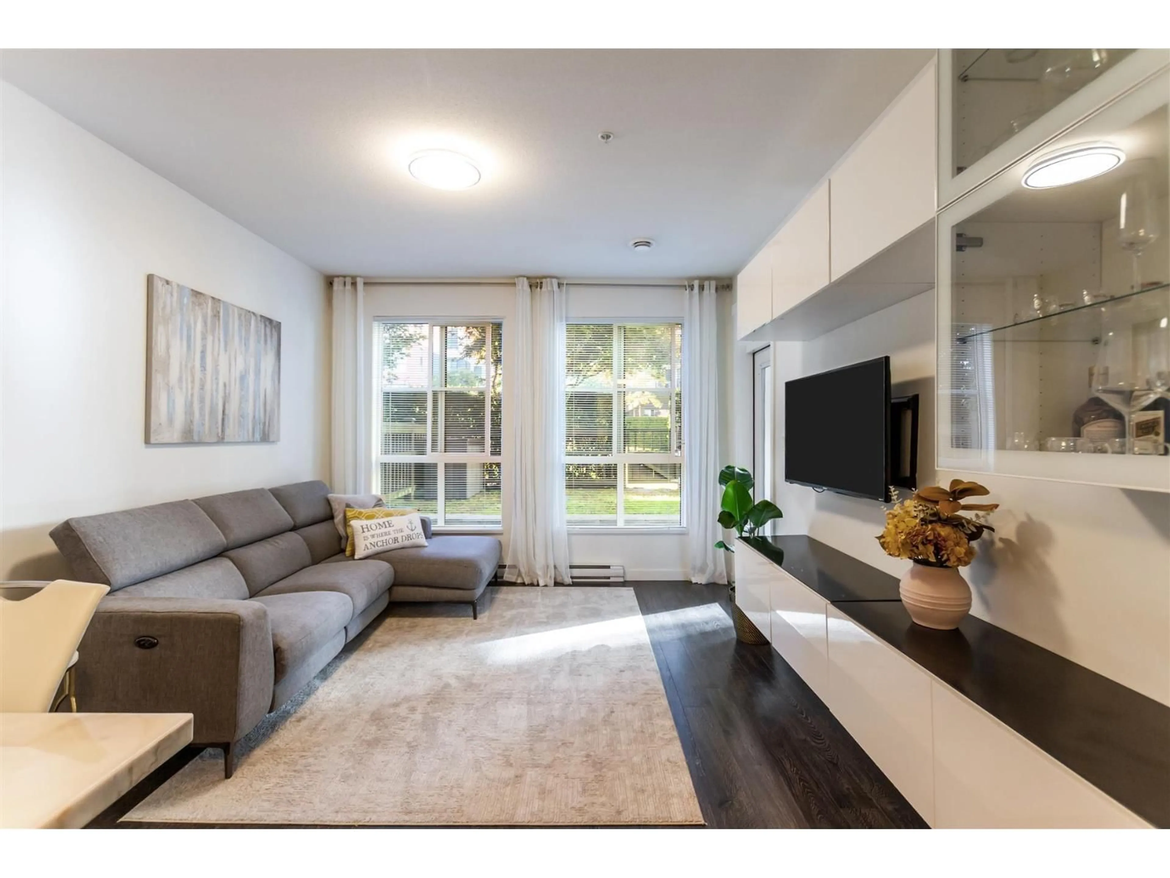Living room with furniture, wood/laminate floor for 130 - 15168 33, Surrey British Columbia V3Z0N7