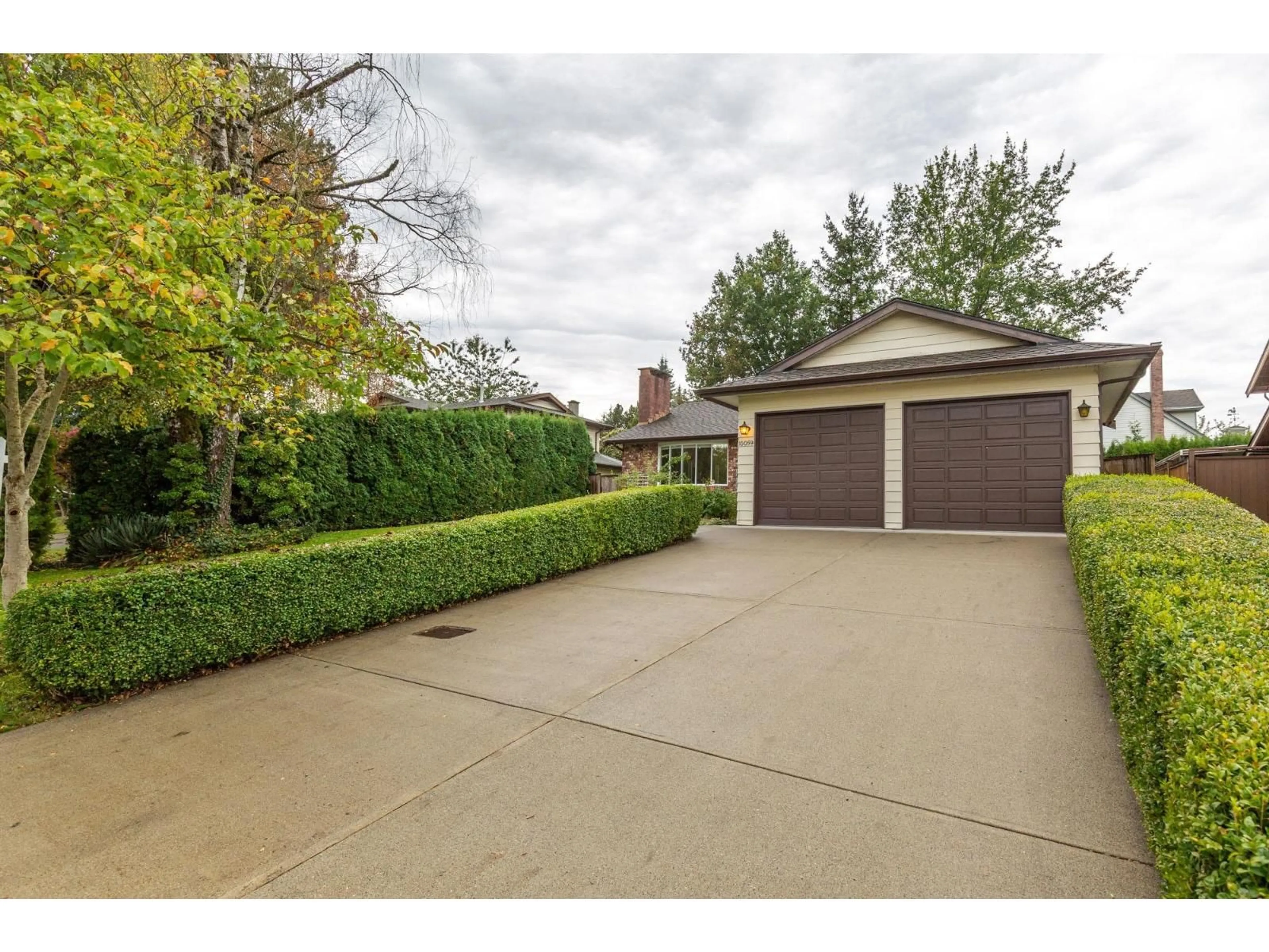 A pic from outside/outdoor area/front of a property/back of a property/a pic from drone, street for 10059 157A, Surrey British Columbia V4N2R5