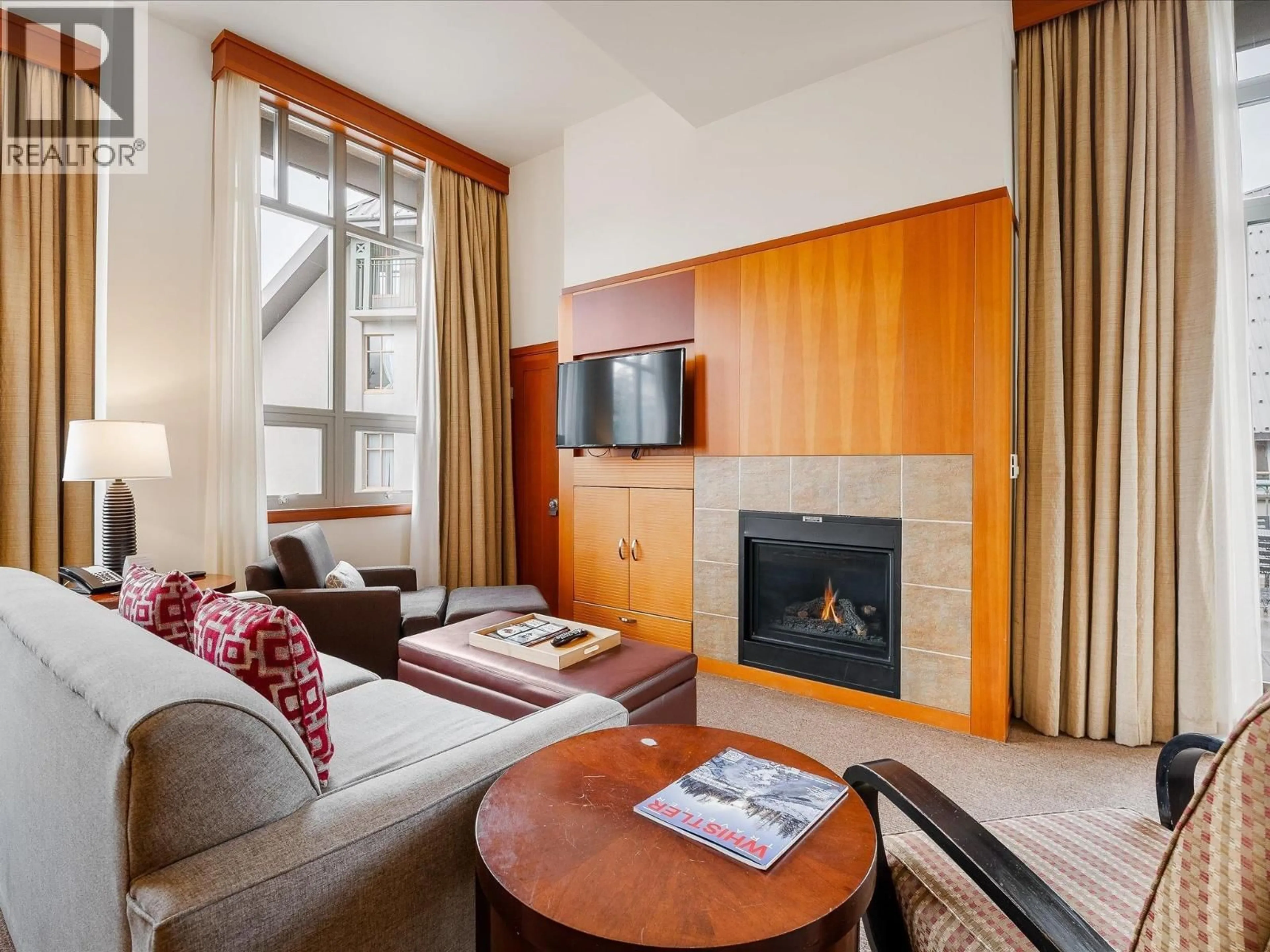 Living room with furniture, wood/laminate floor for 4407 - 4299 BLACKCOMB WAY, Whistler British Columbia V8E0X3