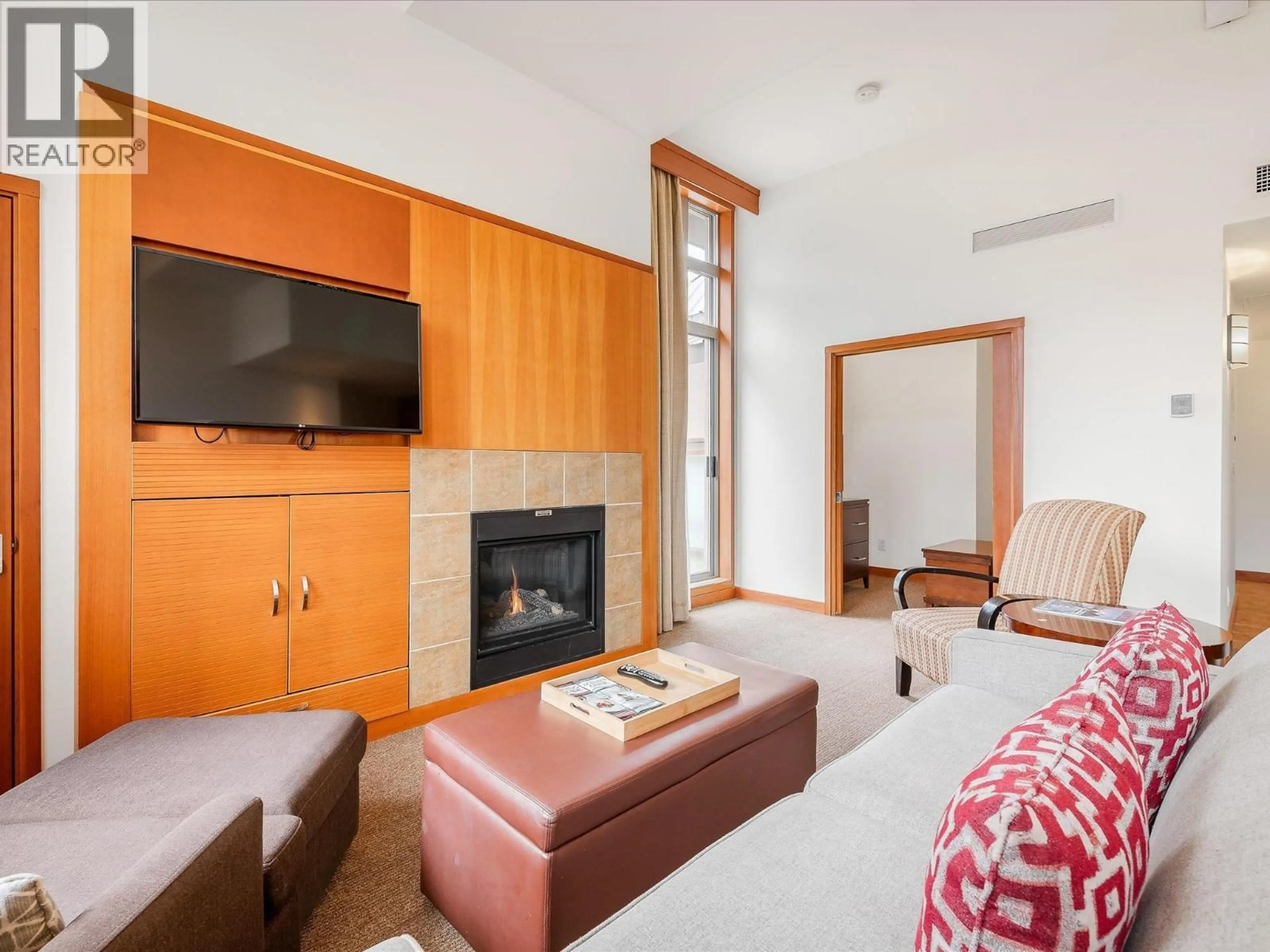 Living room with furniture, wood/laminate floor for 4407 - 4299 BLACKCOMB WAY, Whistler British Columbia V8E0X3