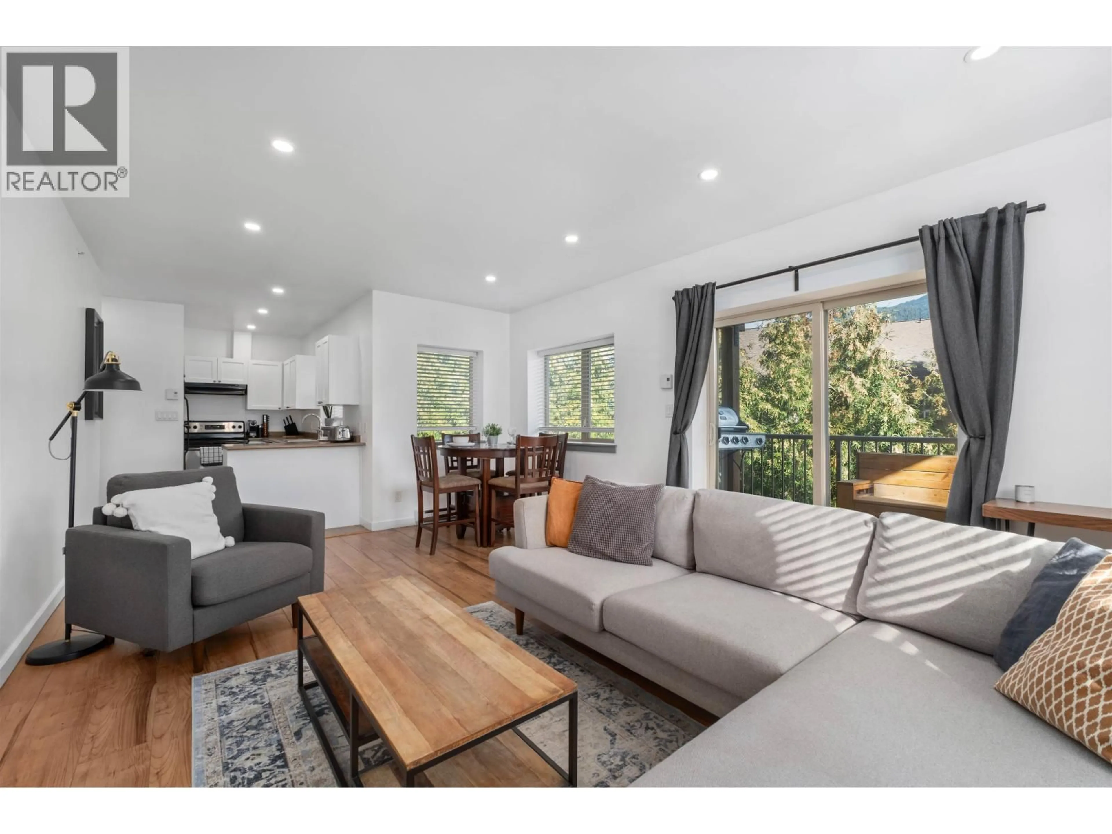 Living room with furniture, wood/laminate floor for 207 - 1411 PORTAGE ROAD, Pemberton British Columbia V0N2L1