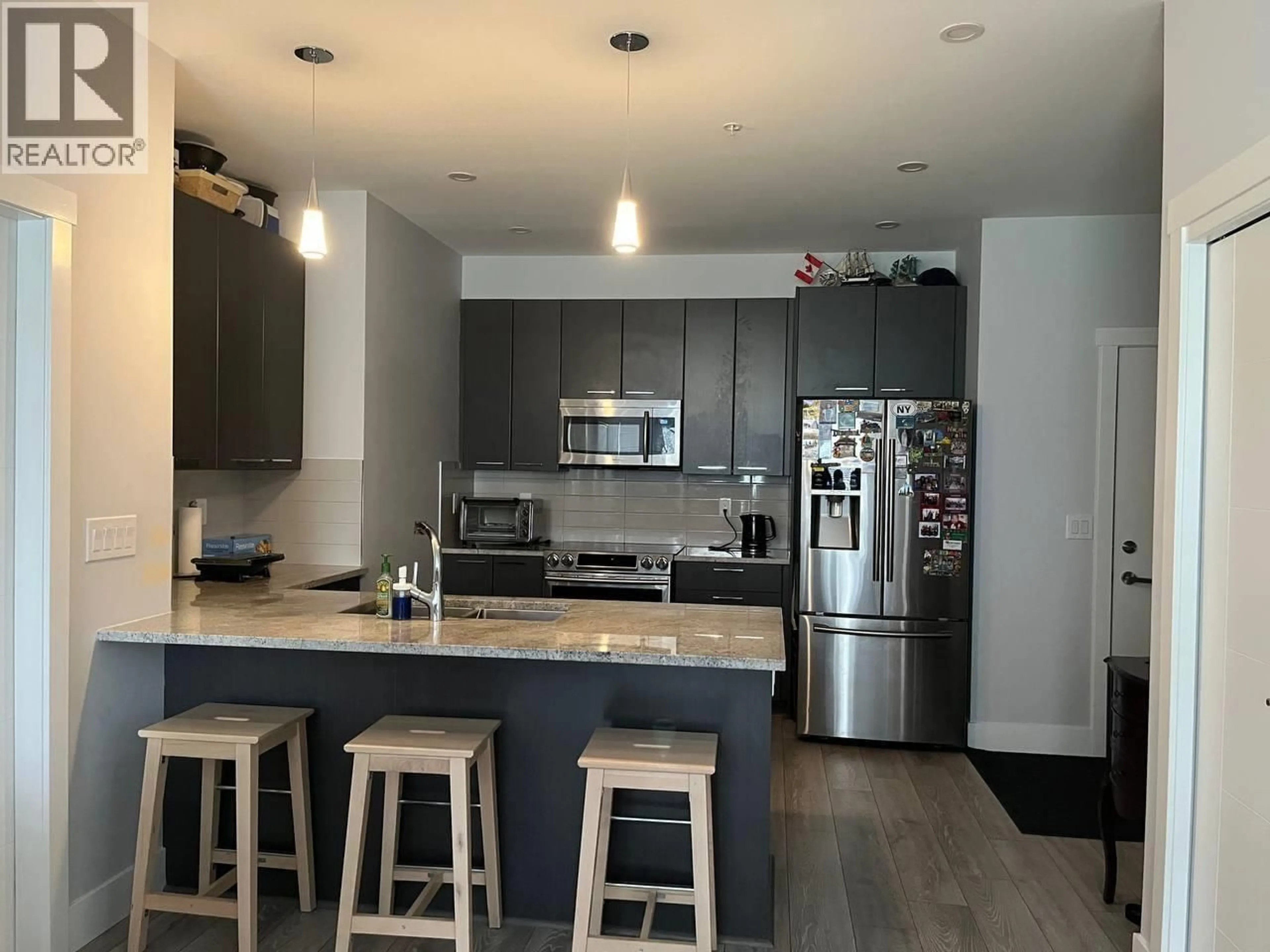 Open concept kitchen, wood/laminate floor for 107 - 22315 122 AVENUE, Maple Ridge British Columbia V2X4K7