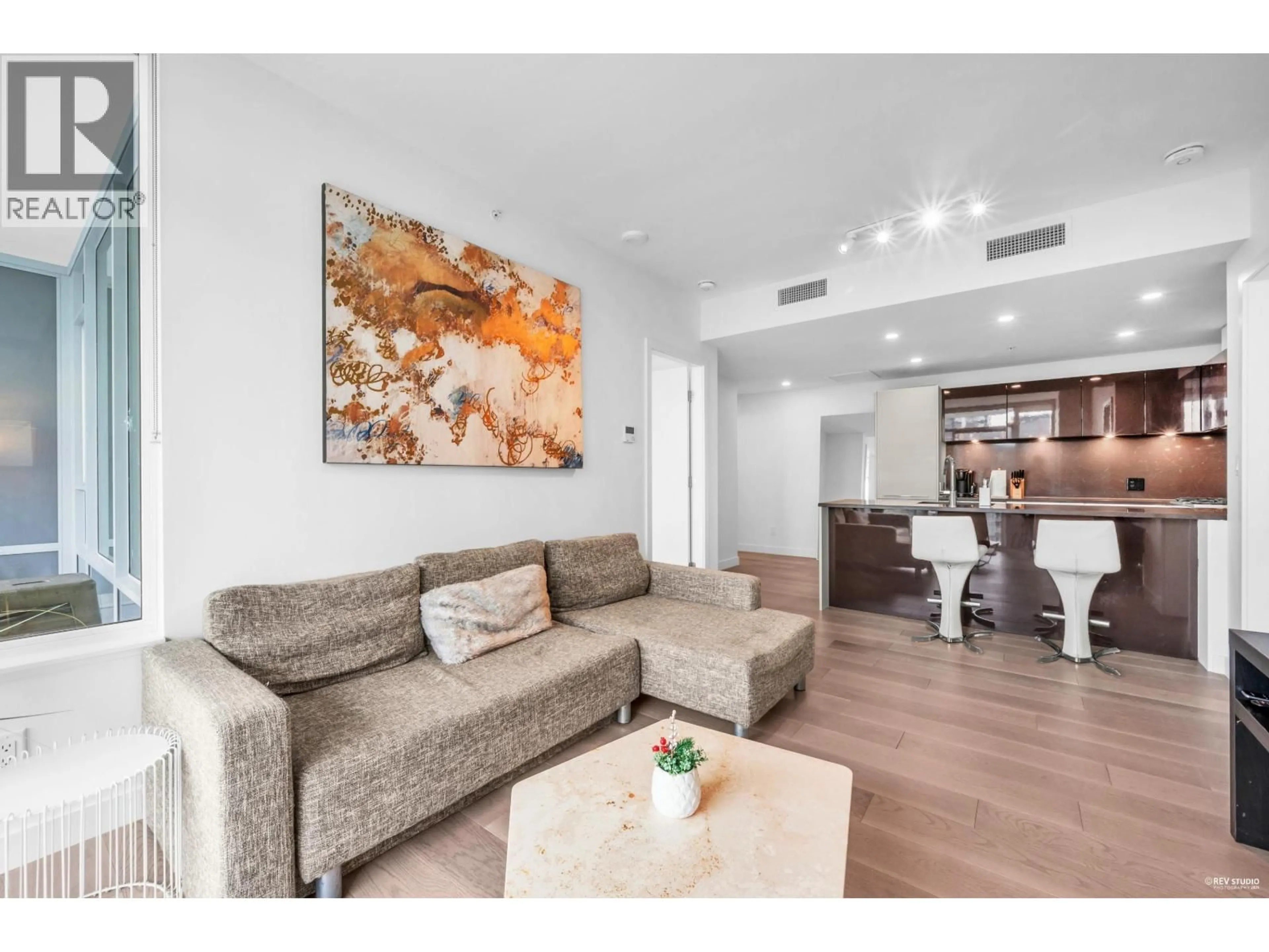 Living room with furniture, wood/laminate floor for 2204 - 6288 CASSIE AVENUE, Burnaby British Columbia V5H0H7