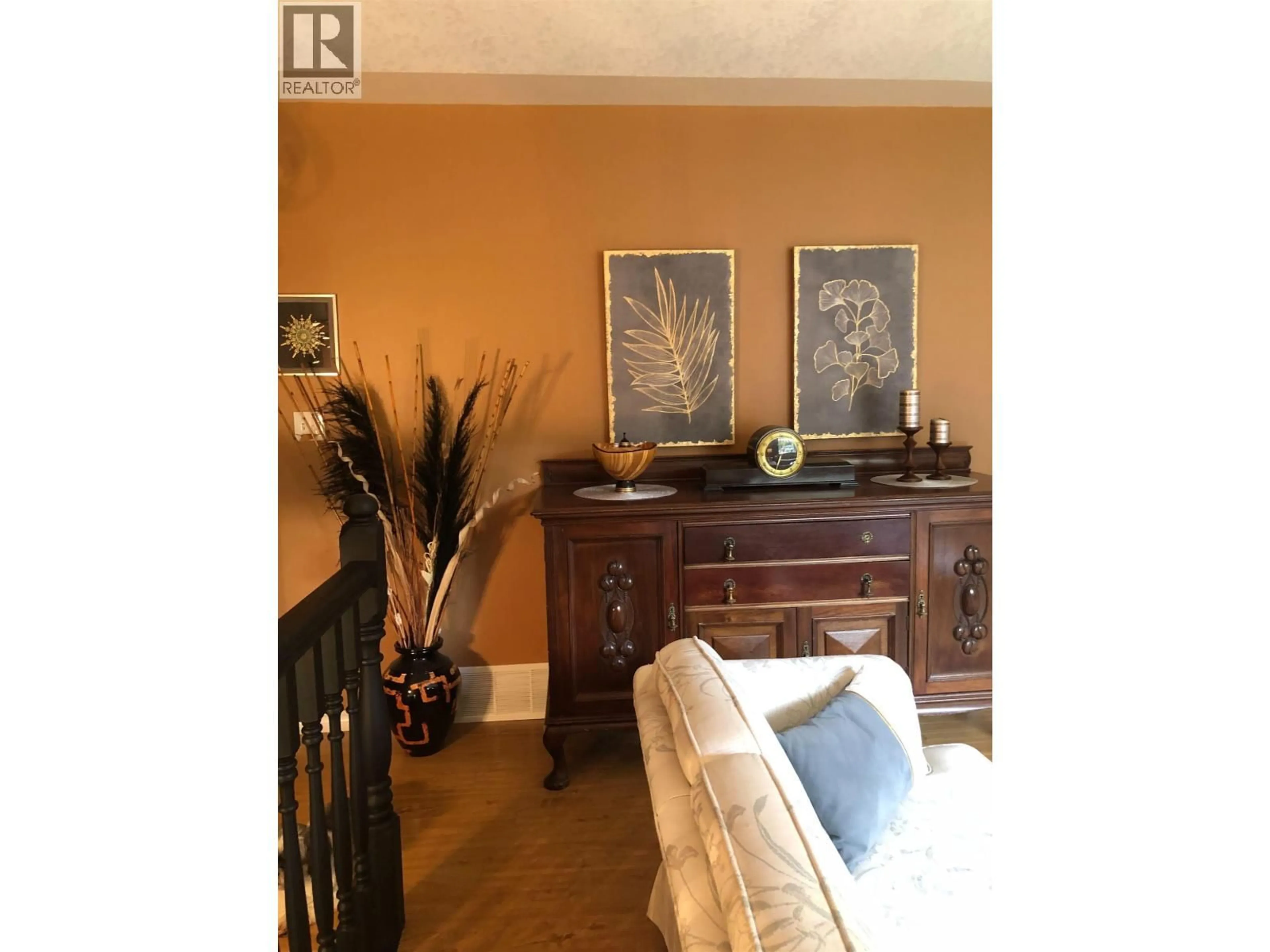 Living room with furniture, wood/laminate floor for 7475 PEARL DRIVE, Prince George British Columbia V2K4K3