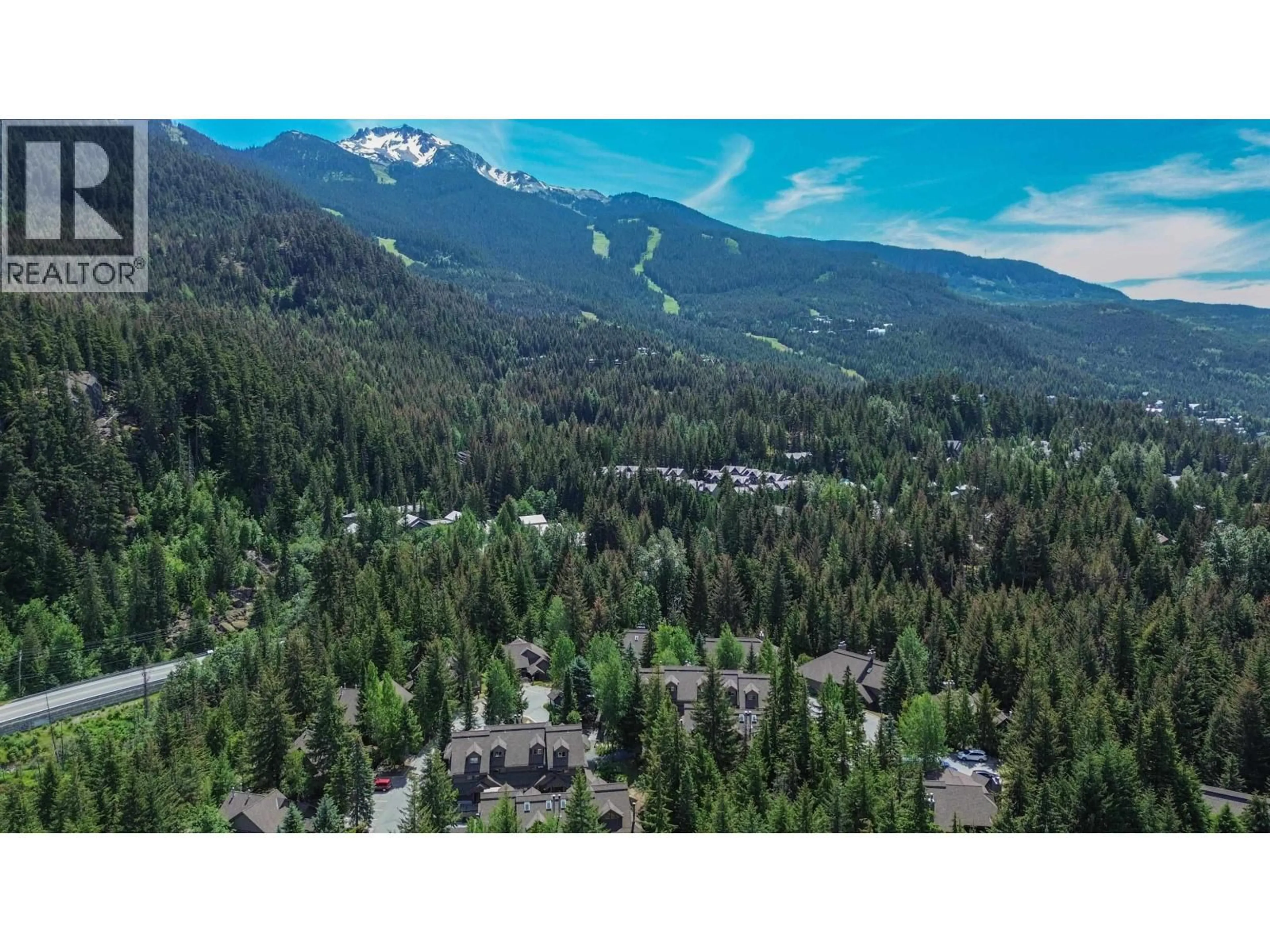 A pic from outside/outdoor area/front of a property/back of a property/a pic from drone, mountain view for 302 - 3050 HILLCREST DRIVE, Whistler British Columbia V0N1B3