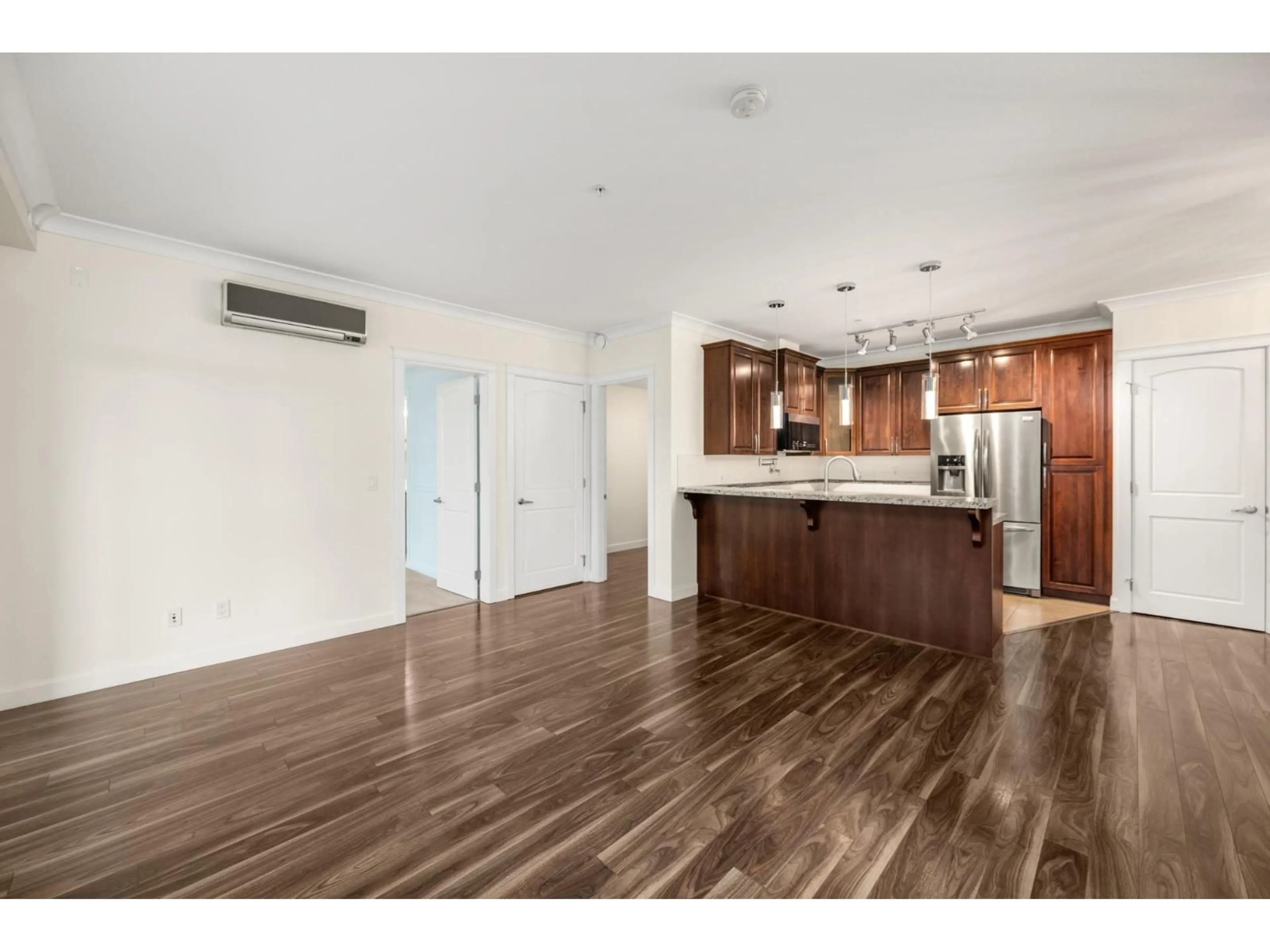 Open concept kitchen, wood/laminate floor for 507 - 2860 TRETHEWEY, Abbotsford British Columbia V2T0G5