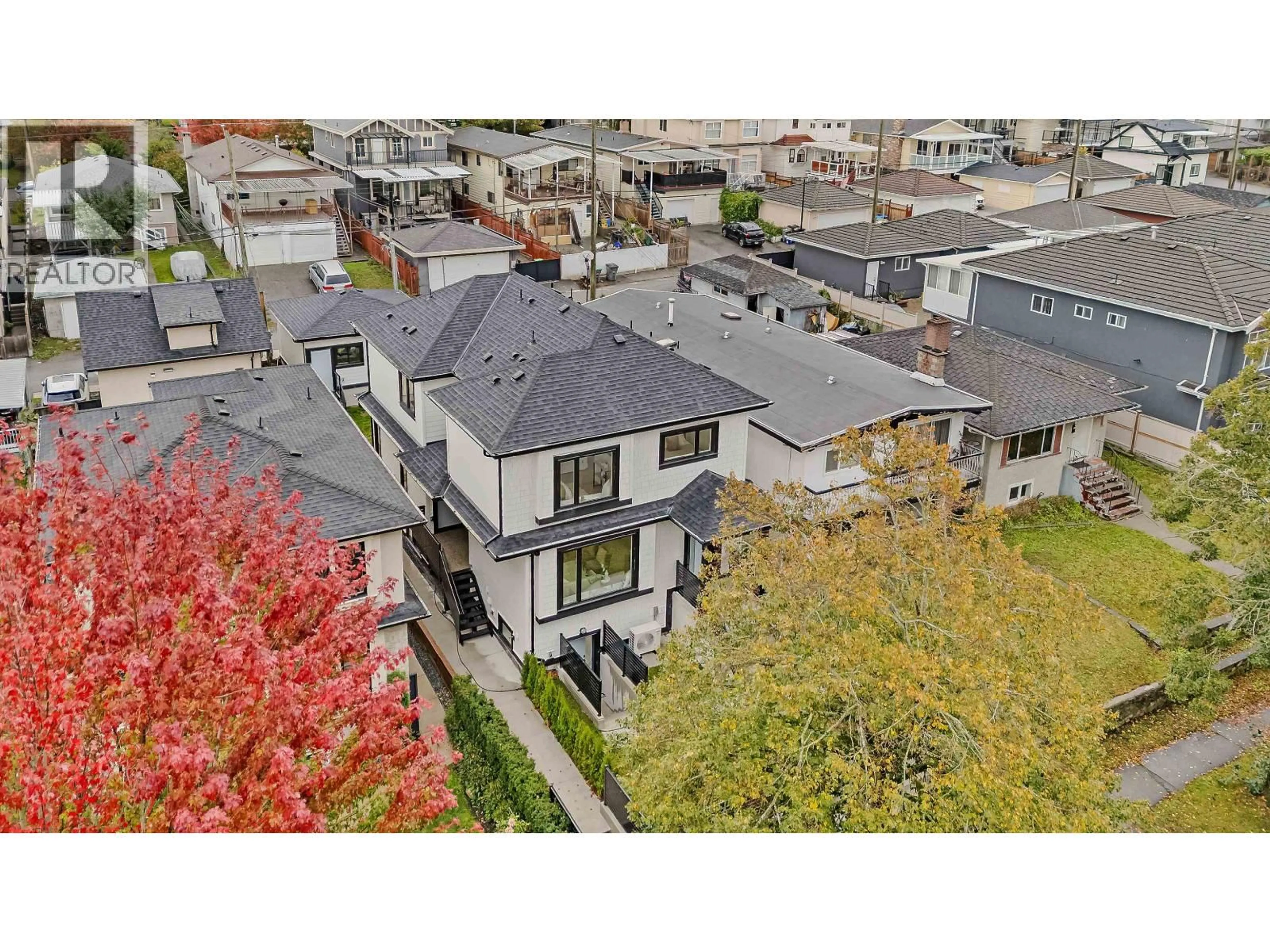 A pic from outside/outdoor area/front of a property/back of a property/a pic from drone, unknown for 1 - 585 E 60TH AVENUE, Vancouver British Columbia V5X2A2