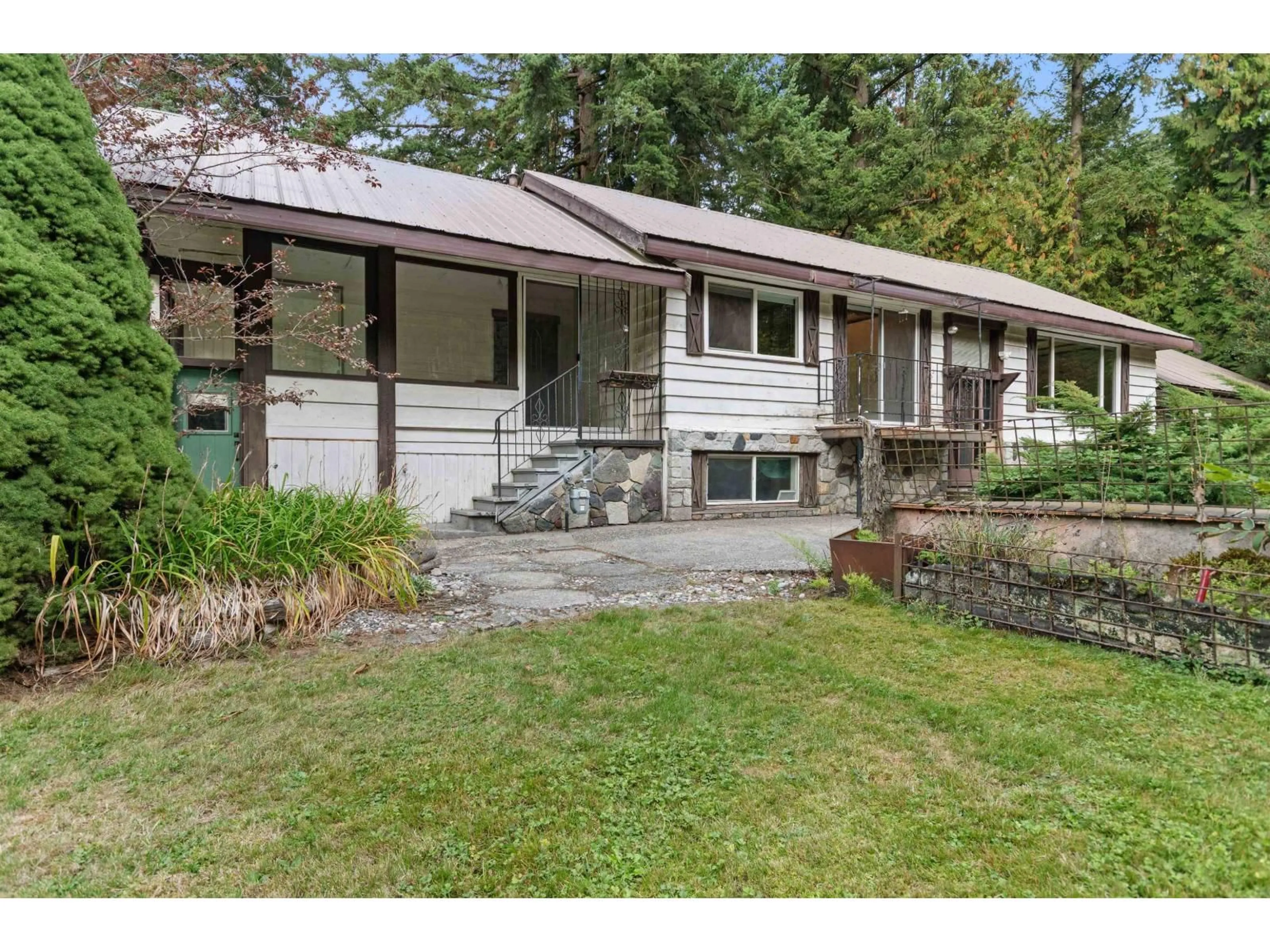 Home with vinyl exterior material, street for 63491 FLOOD HOPE ROAD, Hope British Columbia V0X1L2