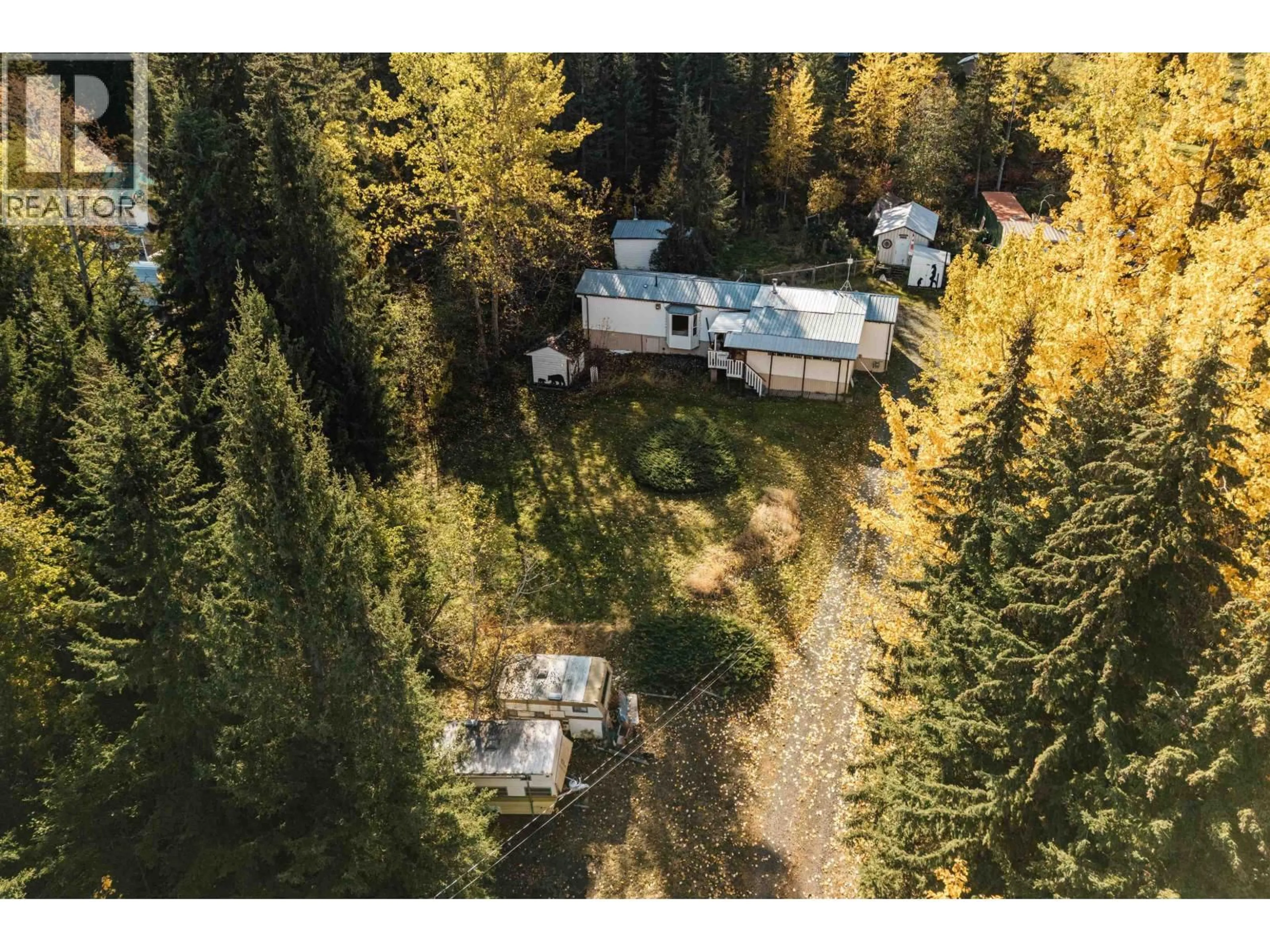 A pic from outside/outdoor area/front of a property/back of a property/a pic from drone, forest/trees view for 6388 MULLIGAN DRIVE, 100 Mile House British Columbia V0K2E3
