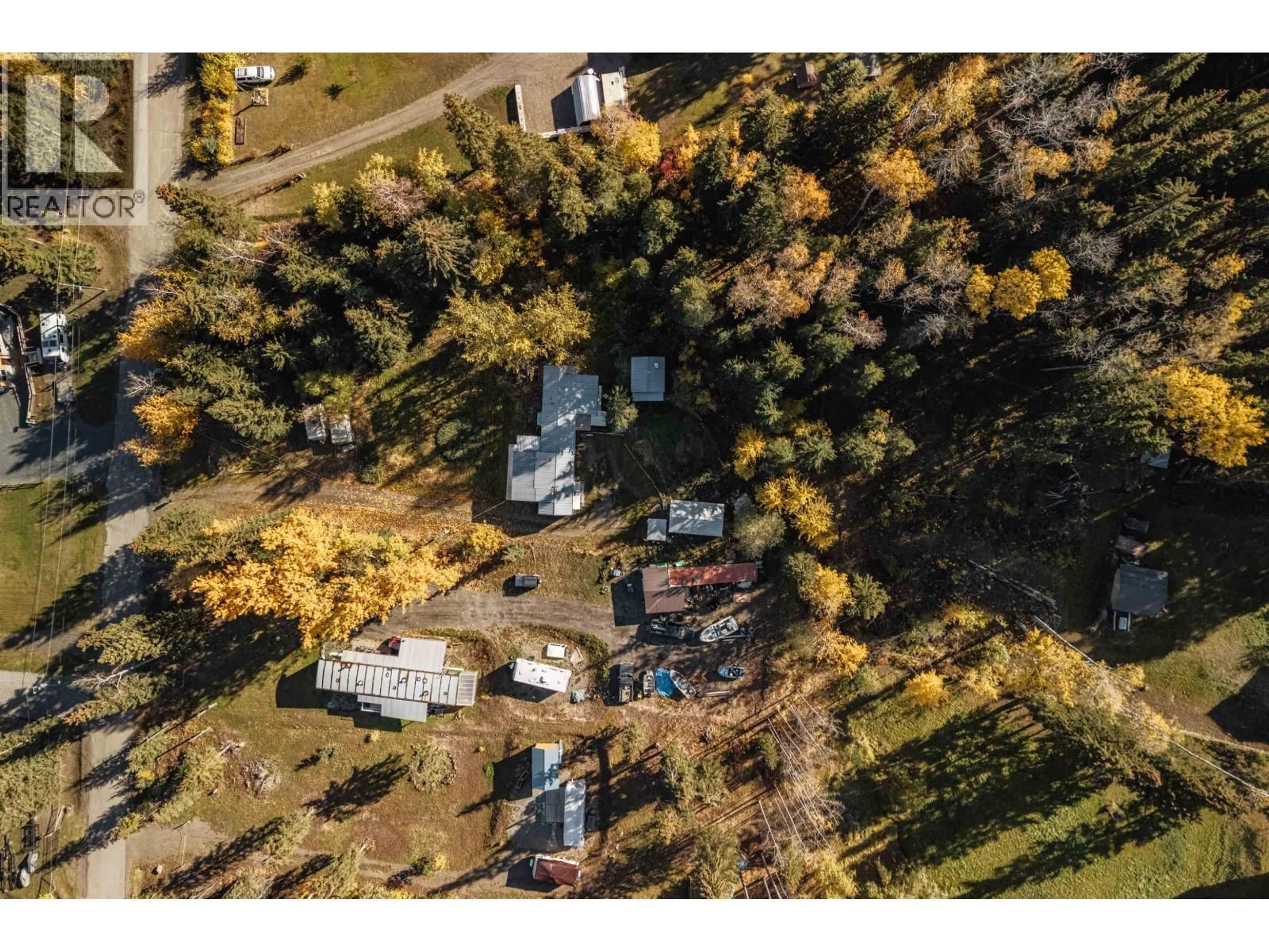 A pic from outside/outdoor area/front of a property/back of a property/a pic from drone, unknown for 6388 MULLIGAN DRIVE, 100 Mile House British Columbia V0K2E3